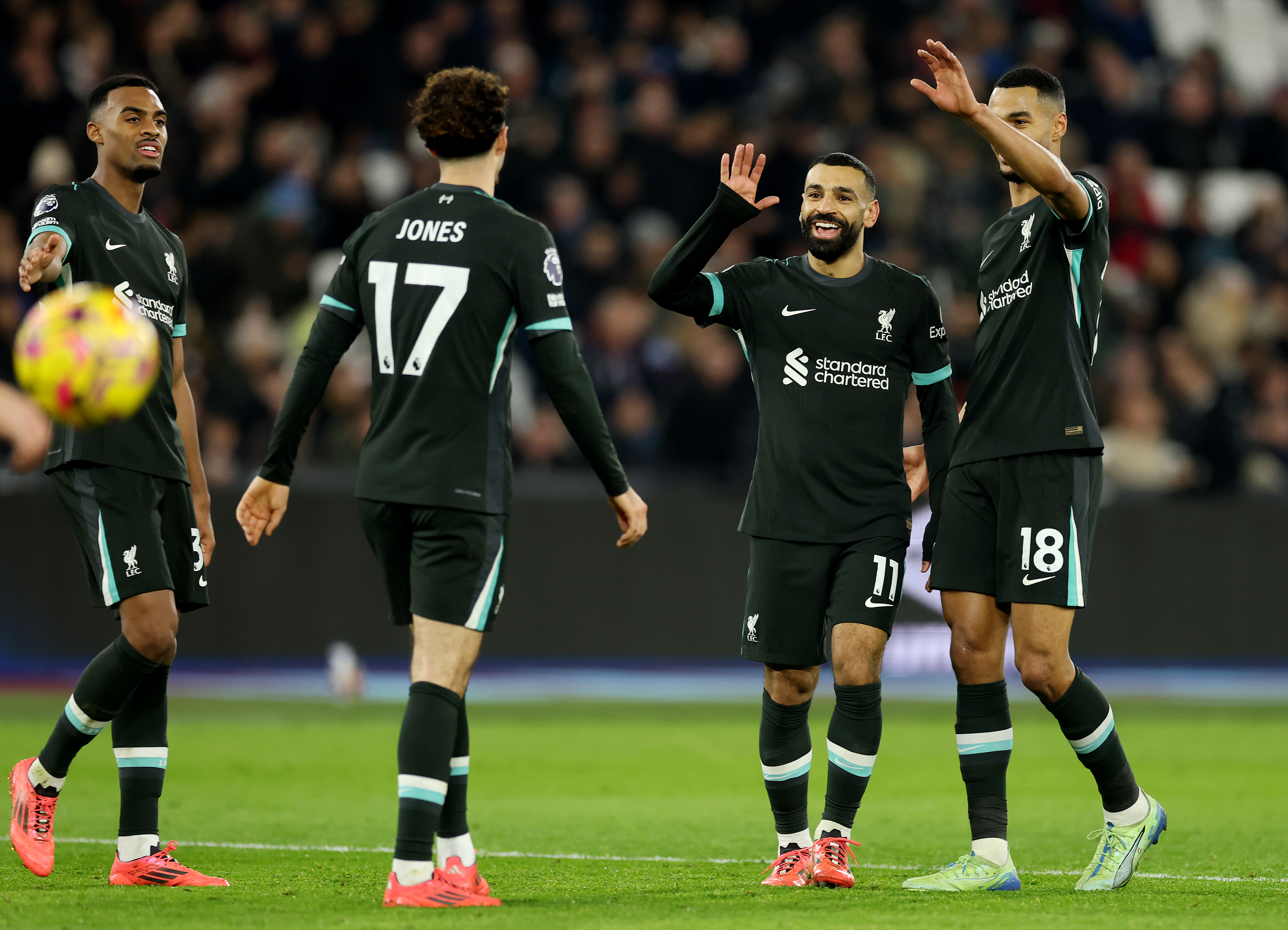 LONDON, ENGLAND - DECEMBER 29: Mohamed Salah of Liverpool celebrates scoring his team's third goal with teammates Cody Gakpo and Curtis Jones during the Premier League match between West Ham United FC and Liverpool FC at London Stadium on December 29, 2024 in London, England. (Photo by Richard Pelham/Getty Images)