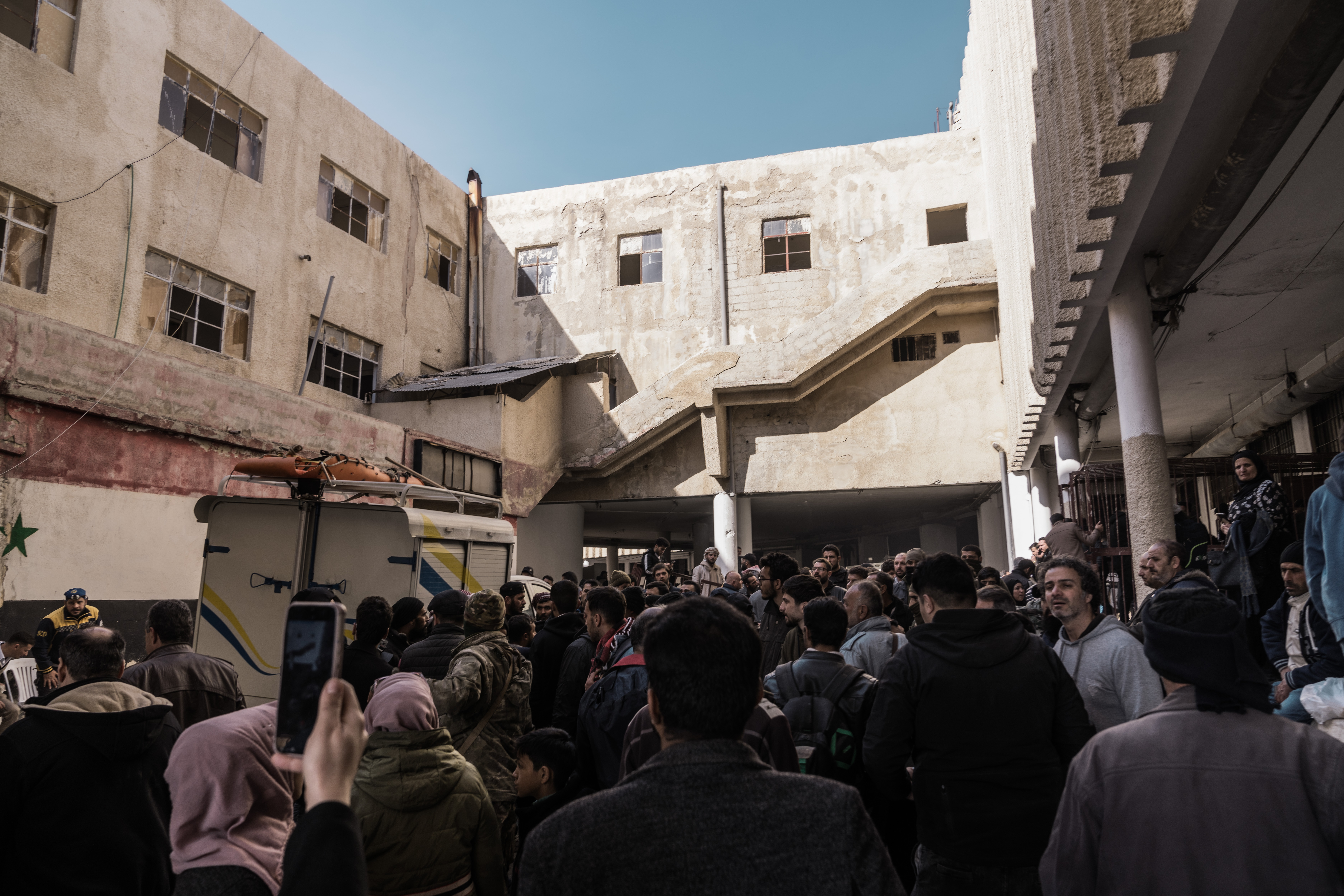 At Sednaya prison, thousands of people search for any sign of loved ones. [Raghed Waked/Al Jazeera]