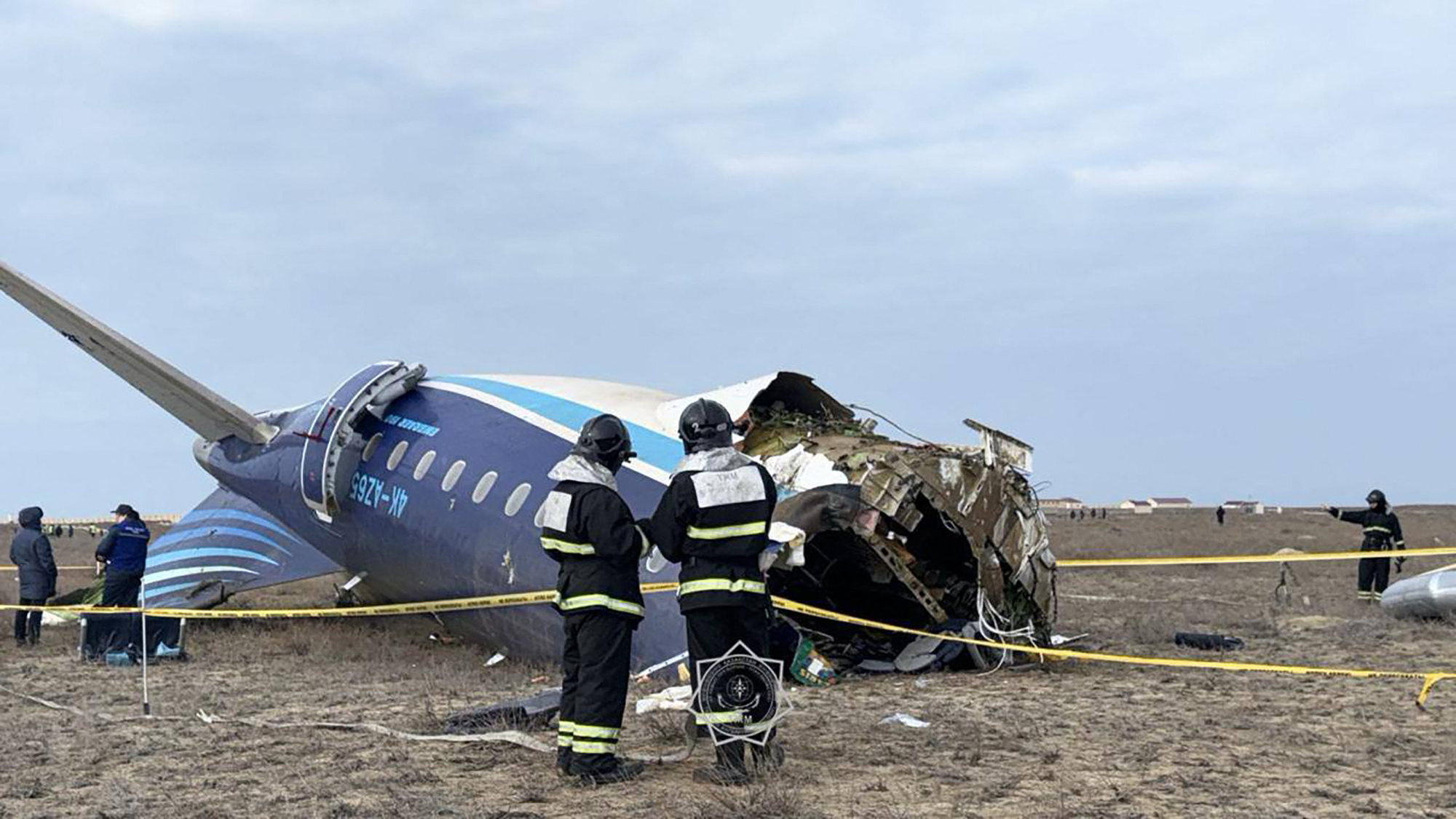 In this handout picture released by Kazakhstan's emergency situations ministry, emergency specialists work at the crash site of an Azerbaijan Airlines passenger jet near the western Kazakh city of Aktau on December 25, 2024. [Handout / Kazakhstan's emergency situations ministry / AFP]