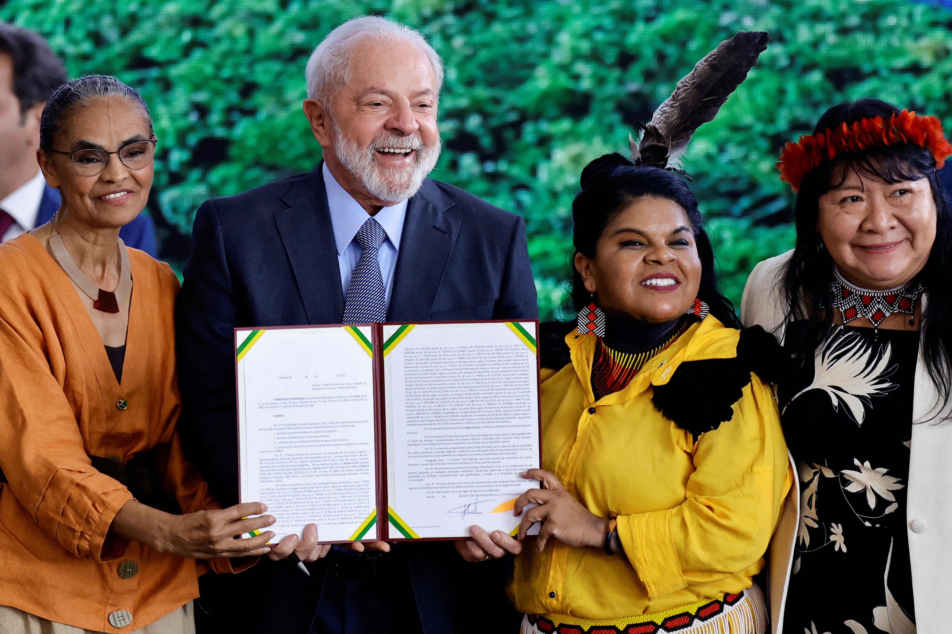 Brazil's President Luiz Inacio Lula da Silva holds a signed document as he stands next to Brazil's Environment Minister Marina Silva, Minister of Indigenous Peoples Sonia Guajajara and President of the National Indigenous Foundation Joenia Wapichana, during a ceremony to commemorate Amazon Day, at the Planalto Palace in Brasilia, Brazil September 5, 2023. REUTERS/Ueslei Marcelino. REFILE - CORRECTING TYPE OF OBJECT FROM PLAQUE TO SIGNED DOCUMENT