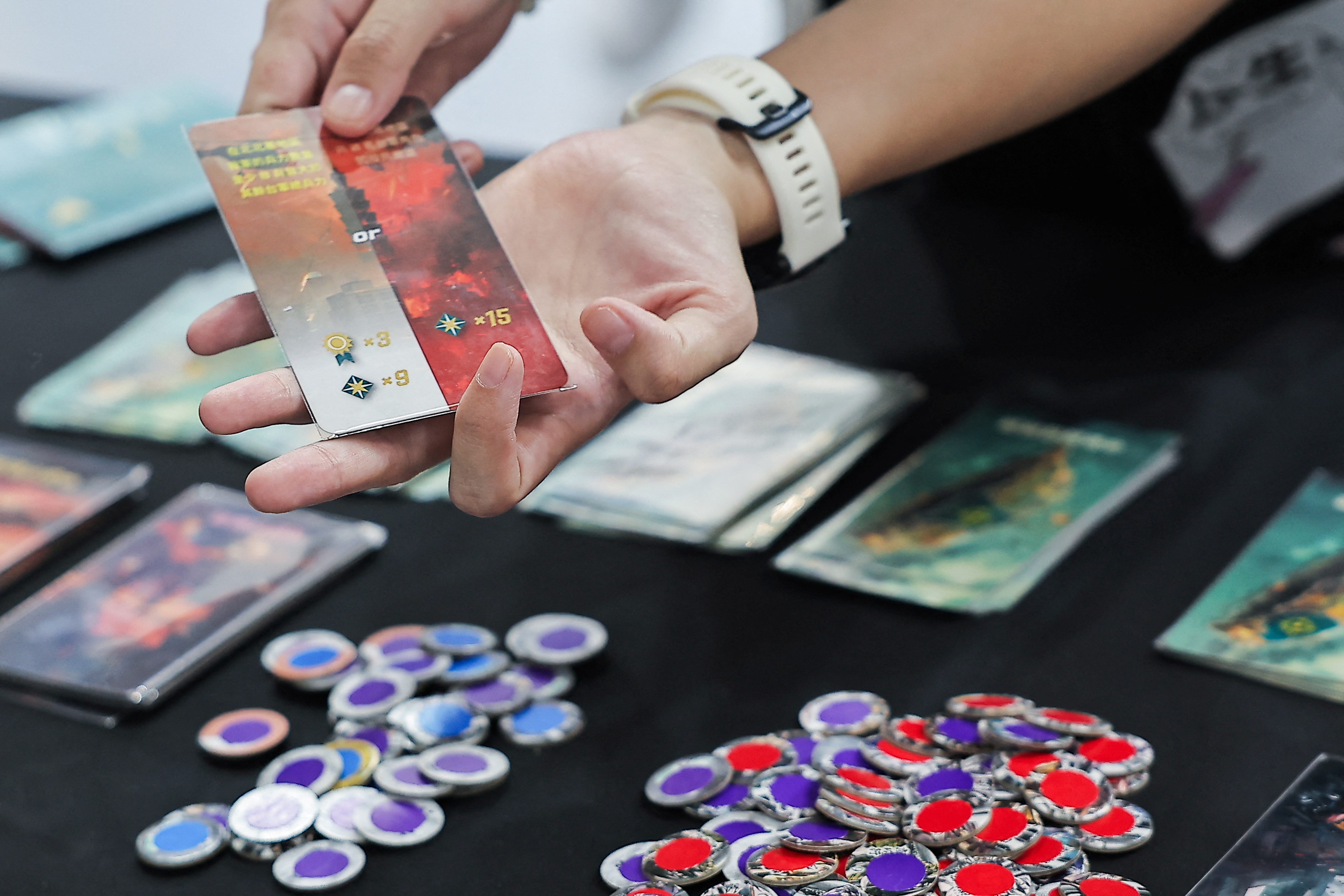 A player tests "2045", a new board game by Mizo Games set against the backdrop of armed conflicts around Taiwan, in Taipei, Taiwan September 22, 2024. REUTERS/Ann Wang