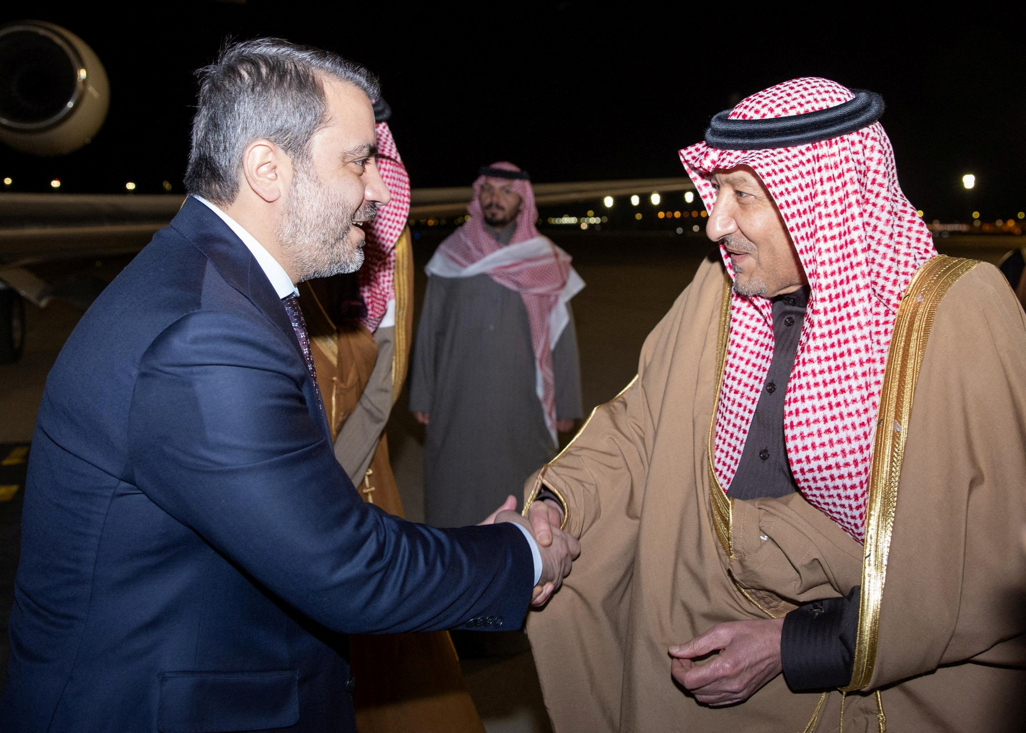 Syria's newly appointed Foreign Minister Asaad Hassan al-Shibani and Saudi Deputy Foreign Minister Waleed Elkhereiji shake hands in Riyadh, Saudi Arabia, January 1, 2025