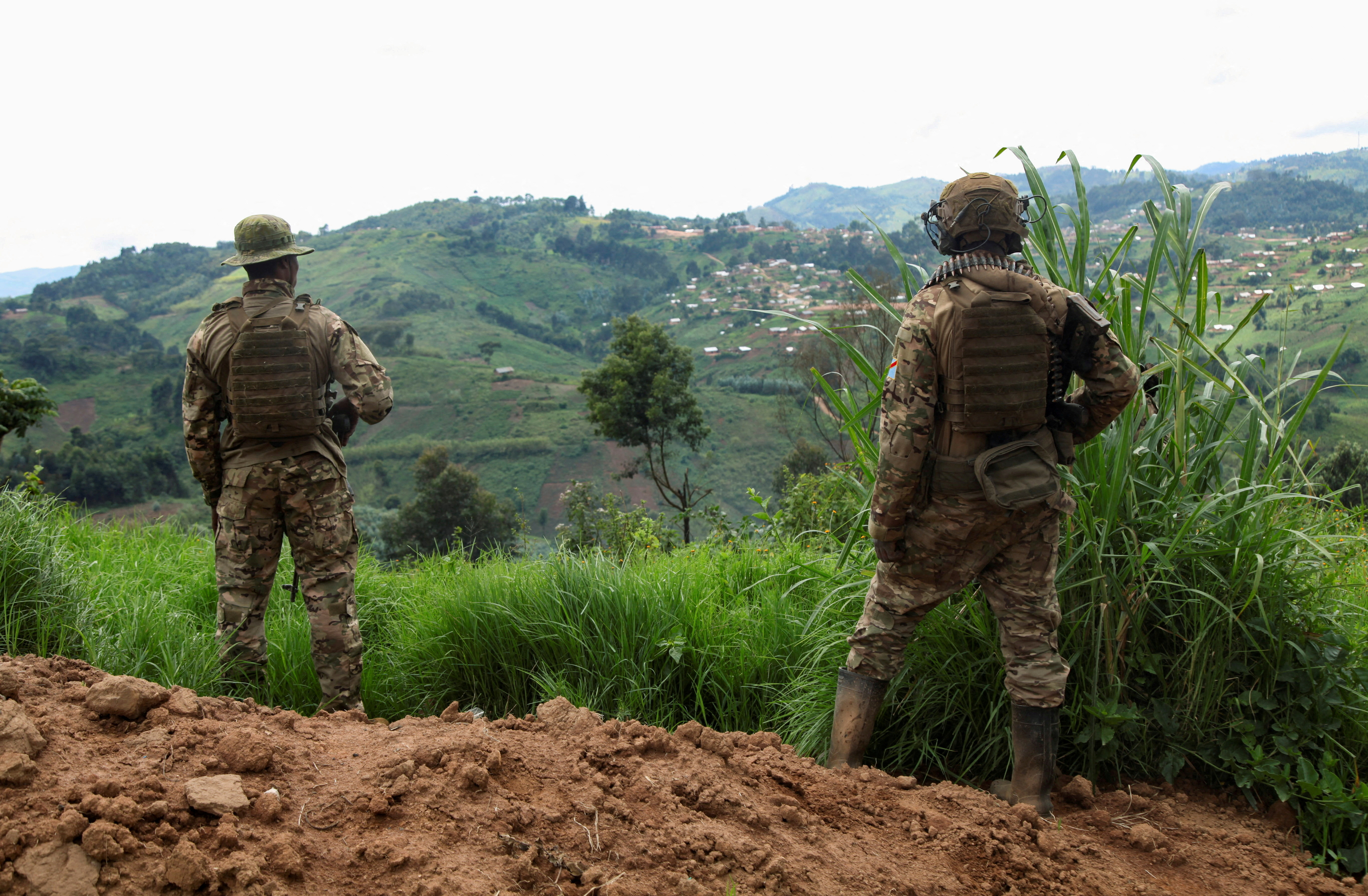 Members of the Armed Forces of the Democratic Republic of the Congo stand guard against the M23 rebel group in Lubero, North Kivu province [File: Djaffar Al Katanty/Reuters]