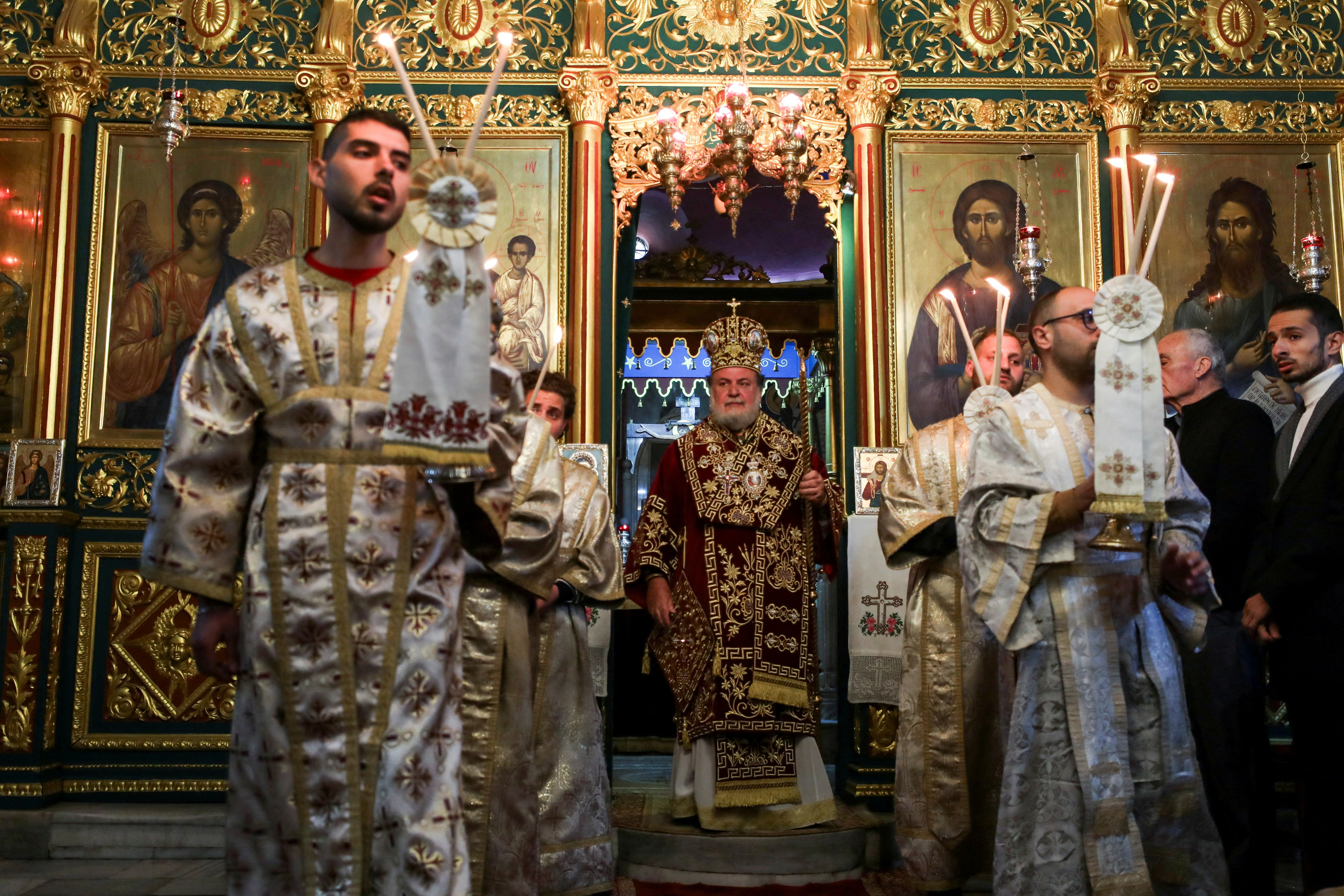 Greek Orthodox Patriarchate Archbishop Alexios attends an Orthodox Christmas Mass at the Greek Orthodox Saint Porphyrius Church in Gaza.