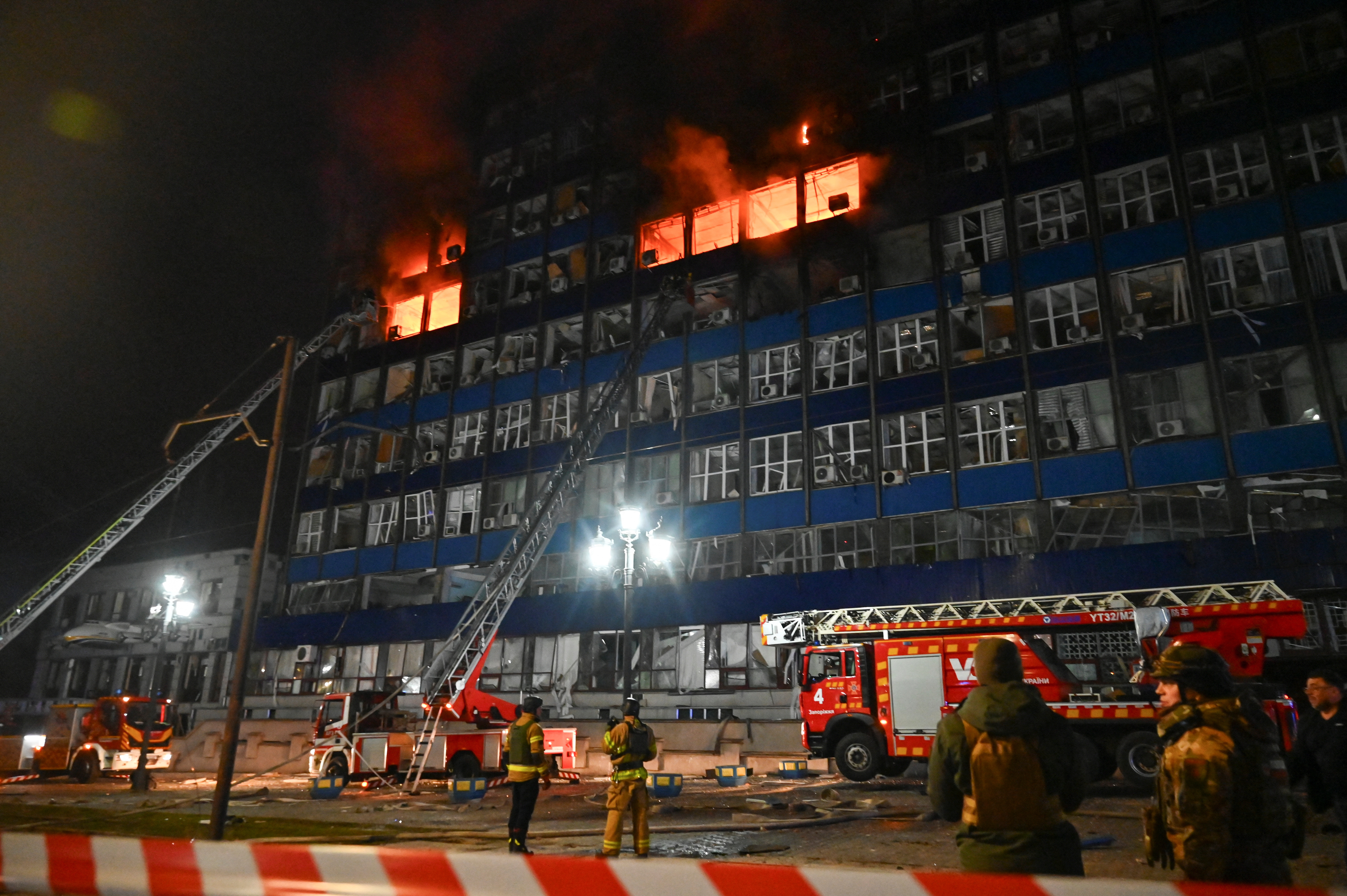 Firefighters work at the site of an administrative building damaged by Russian air and missile strikes, amid Russia's attack on Ukraine, in Zaporizhzhia, Ukraine January 8, 2025. REUTERS/Stringer