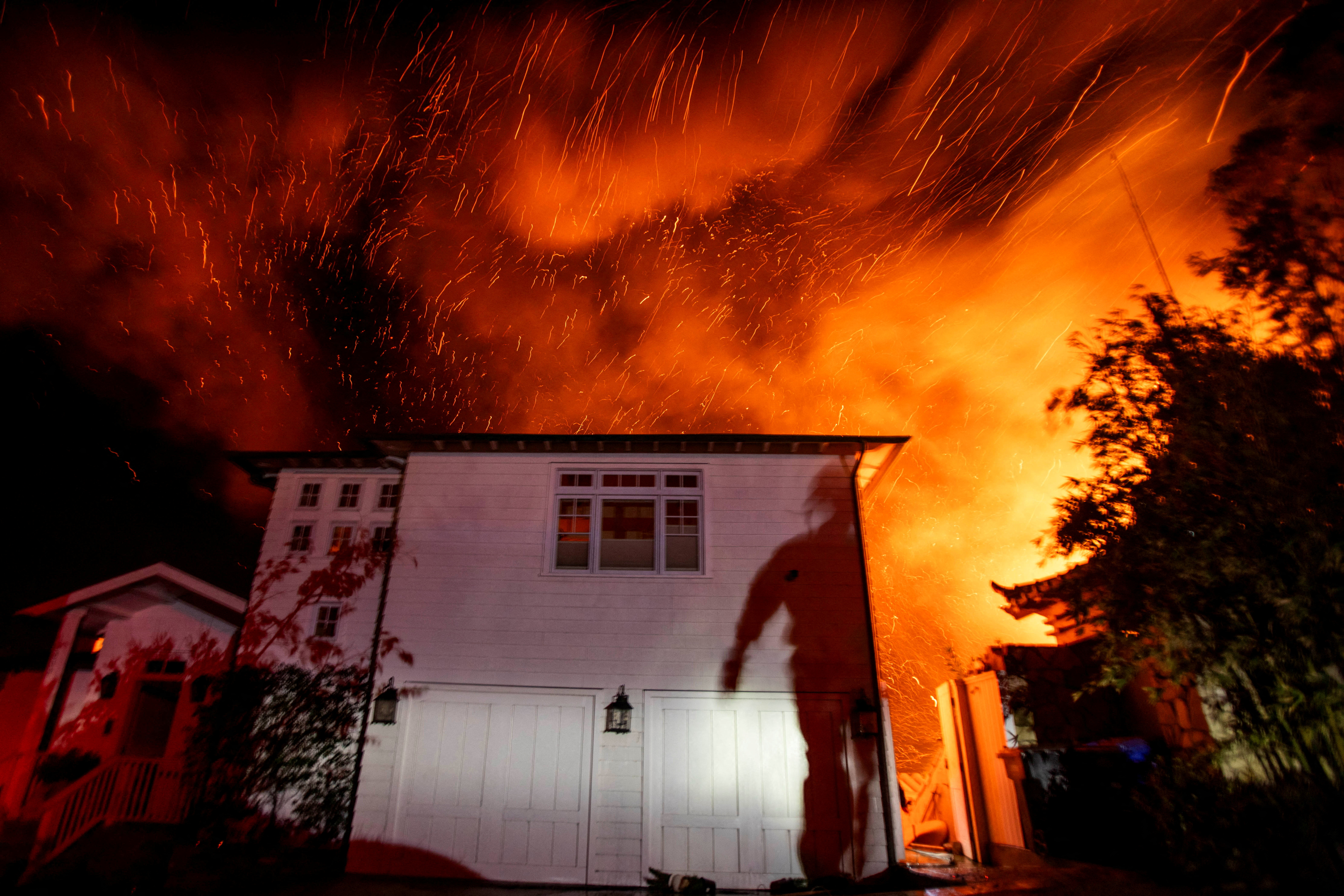 The wind whips embers as the Palisades fire burns during a windstorm on the west side of Los Angeles, California, U.S. January 8