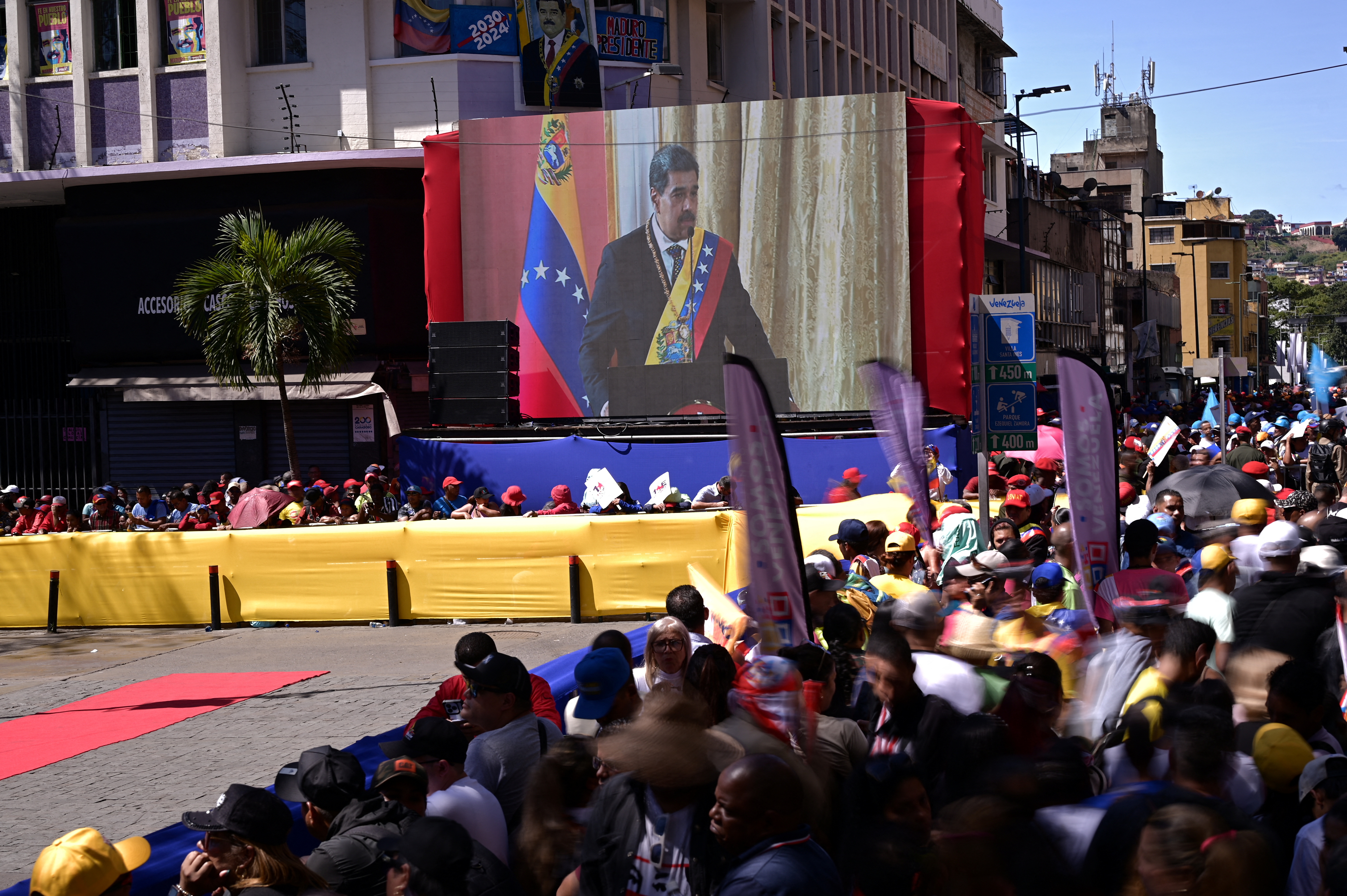 A screen outside in Caracas shows the Nicolas Maduro inauguration.