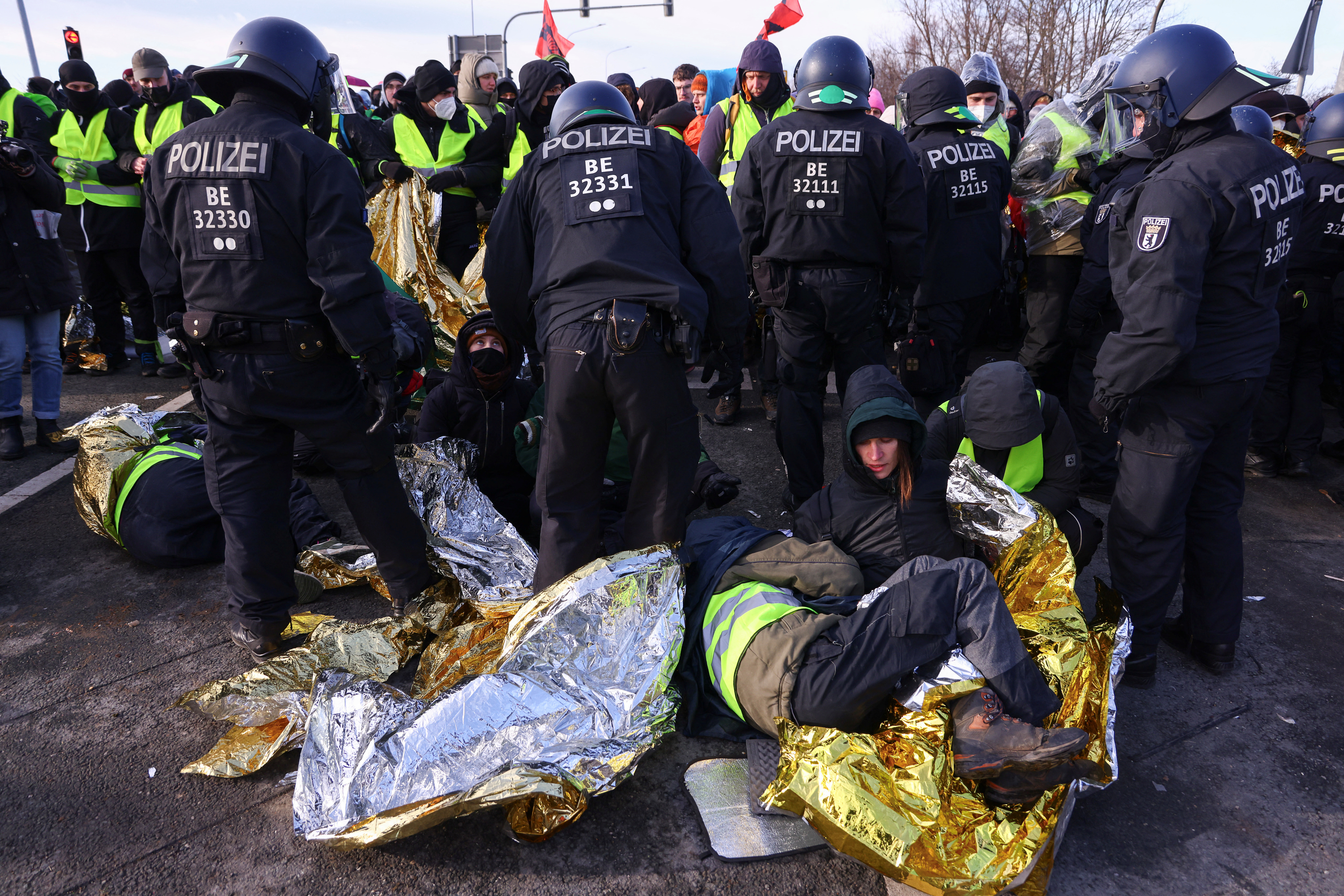 Police officers clash with protesters.