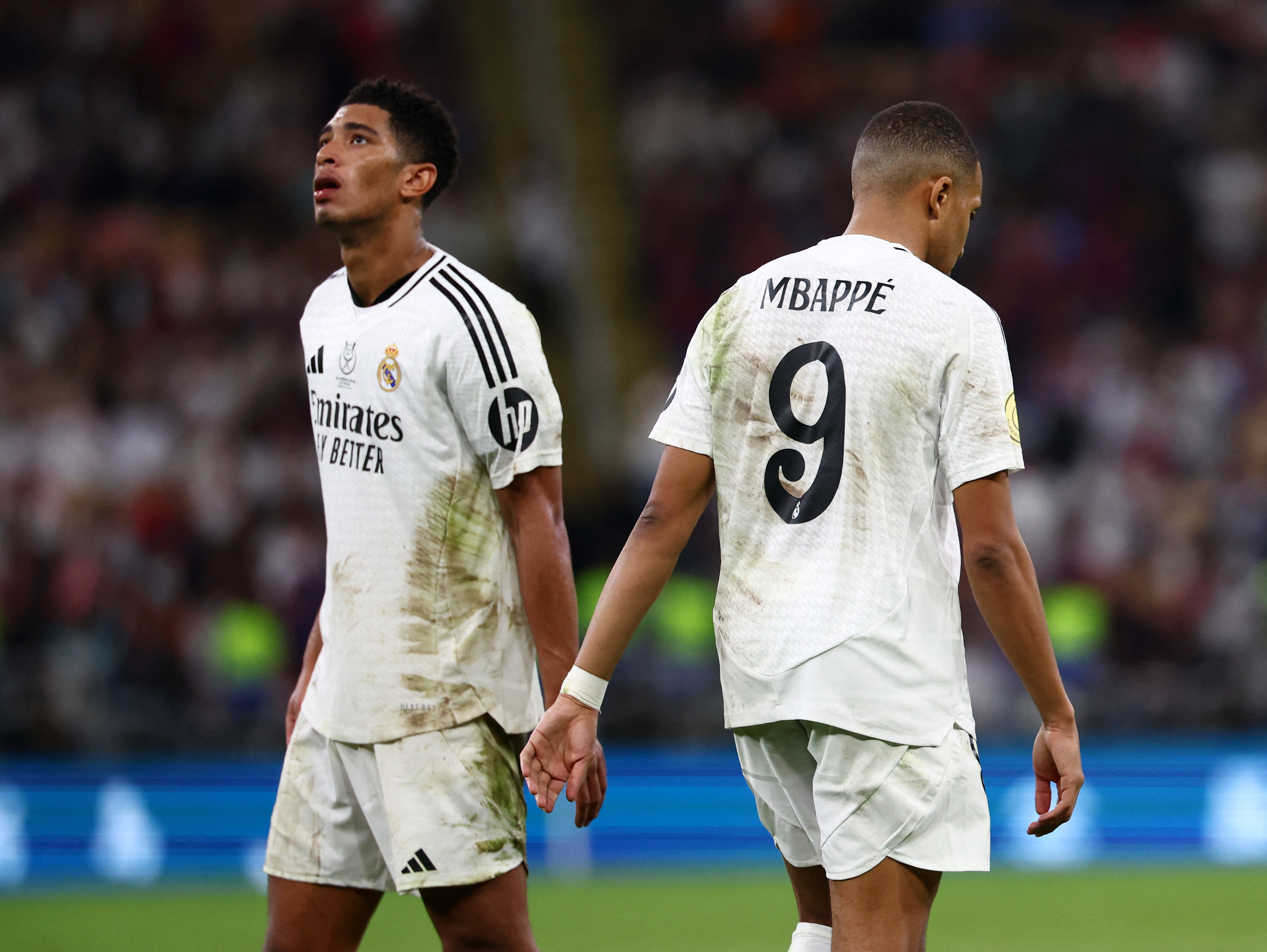 Soccer Football - Spanish Super Cup - Final - FC Barcelona v Real Madrid - King Abdullah Sports City, Jeddah, Saudi Arabia - January 12, 2025 Real Madrid's Kylian Mbappe and Jude Bellingham look dejected at the end of the match REUTERS/Pedro Nunes