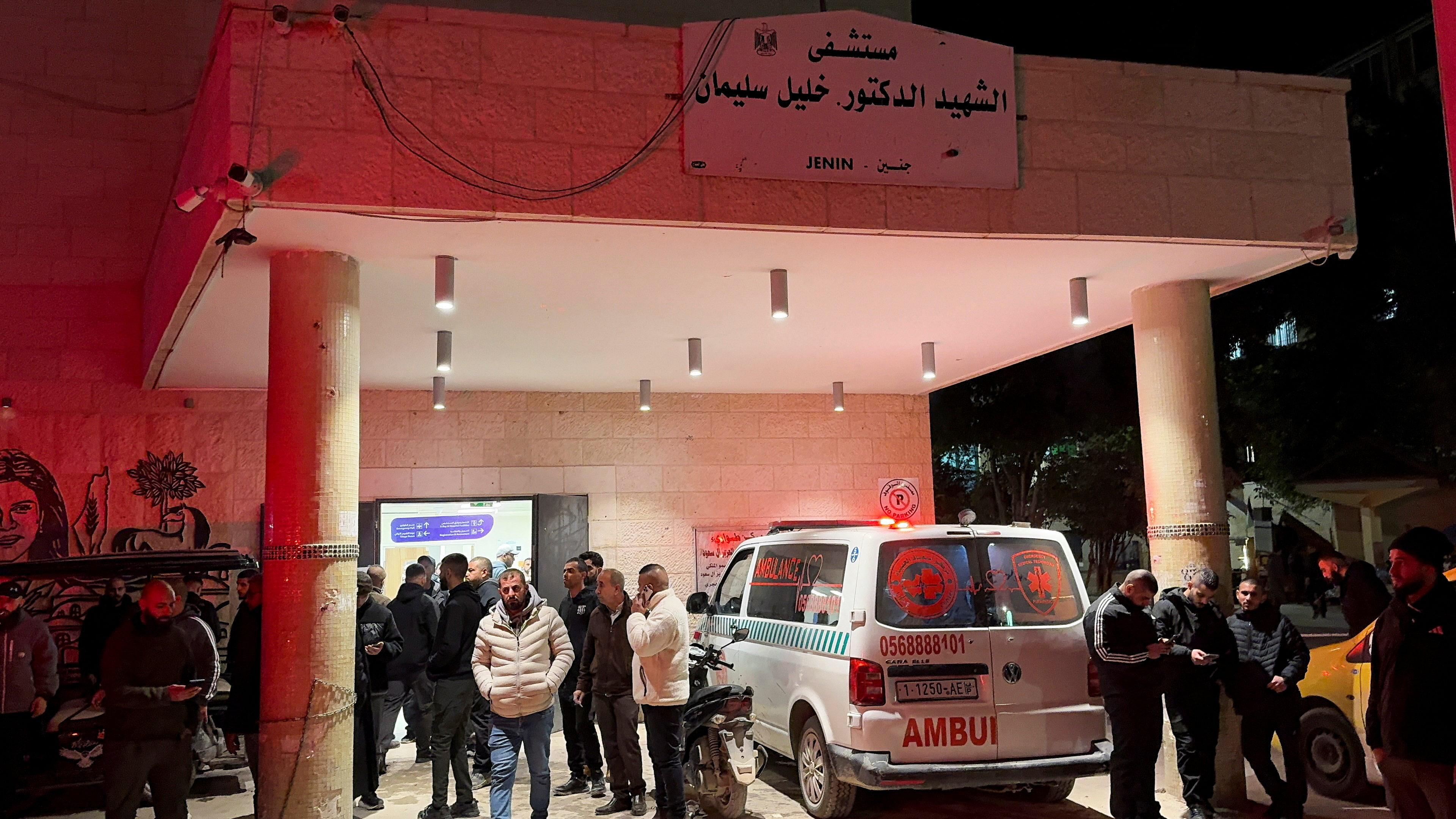 People gather in front of a hospital, after several Palestinians were killed in an Israeli strike, in Jenin in the Israeli-occupied West Bank January 14, 2025. REUTERS/Mohammad Ali