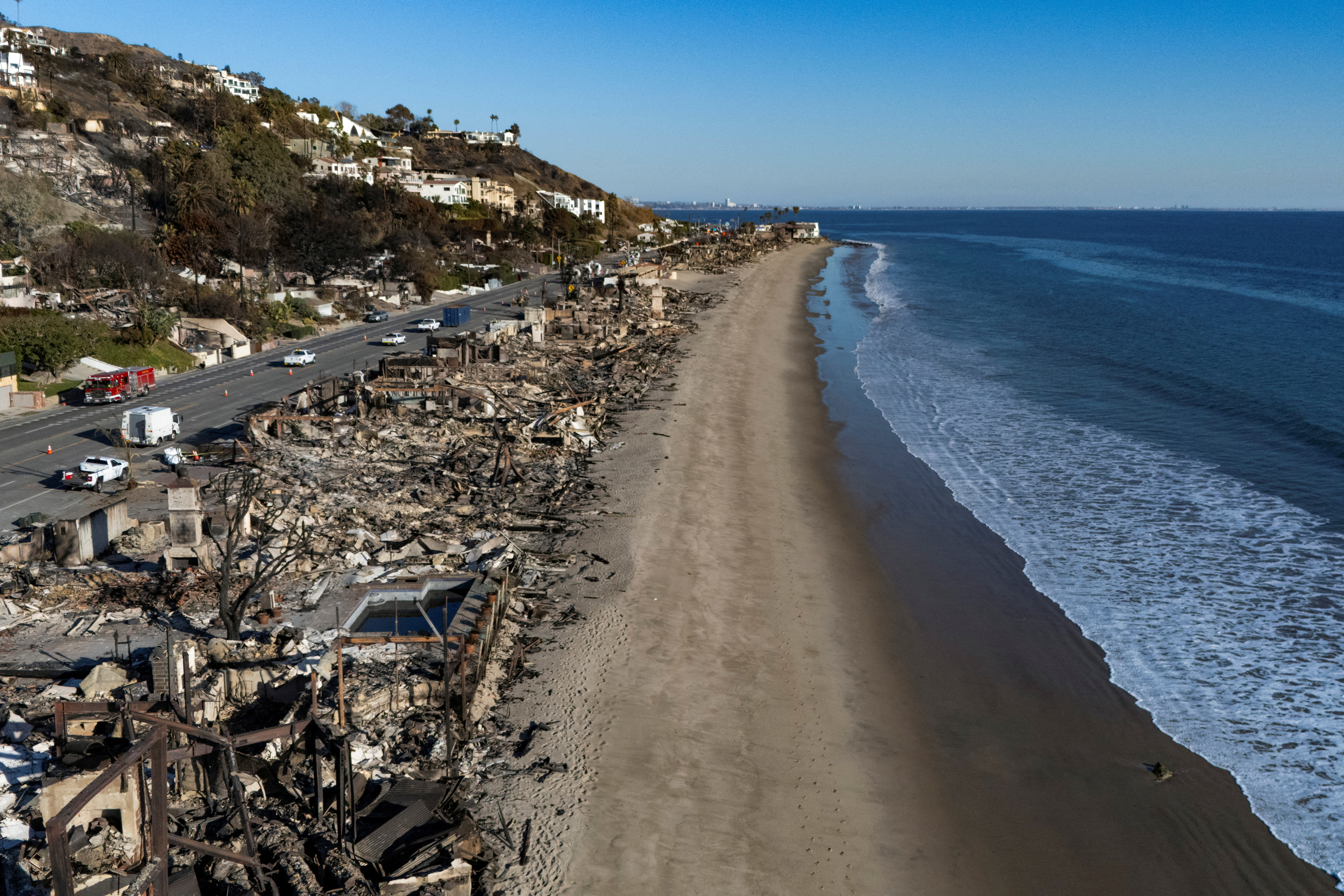 A drone picture shows debris from burned properties.