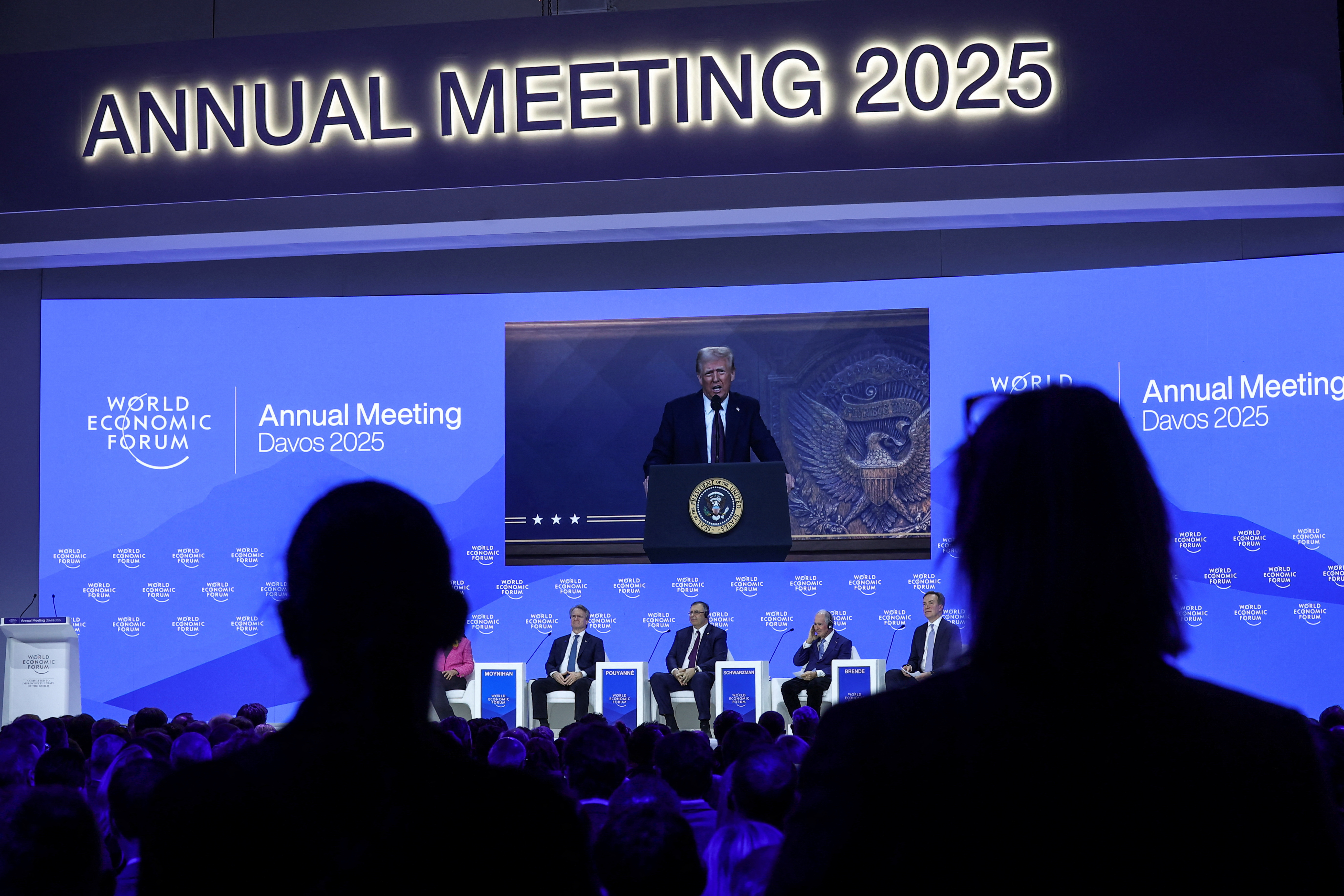 Donald Trump speaks on screen at Davos World Economic Forum.