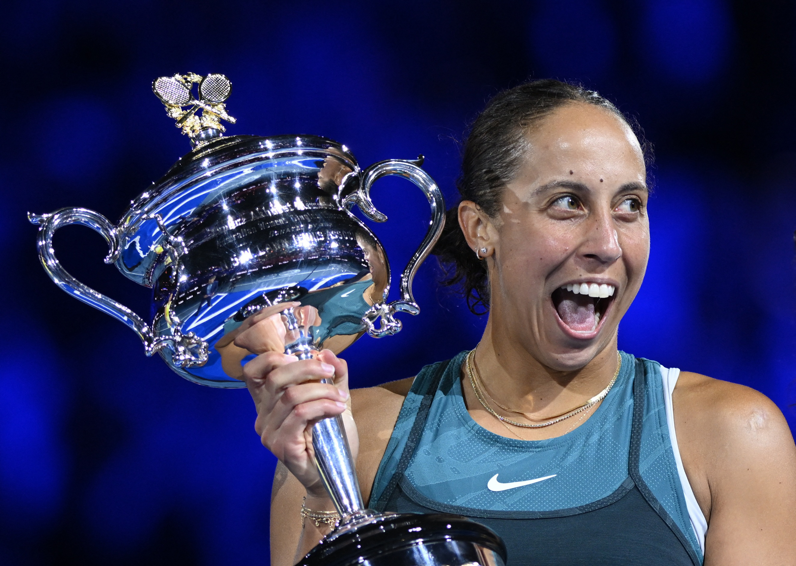 Tennis - Australian Open - Melbourne Park, Melbourne, Australia - January 25, 2025 Madison Keys of the U.S. celebrates with the trophy after winning the final against Belarus' Aryna Sabalenka REUTERS/Jaimi Joy