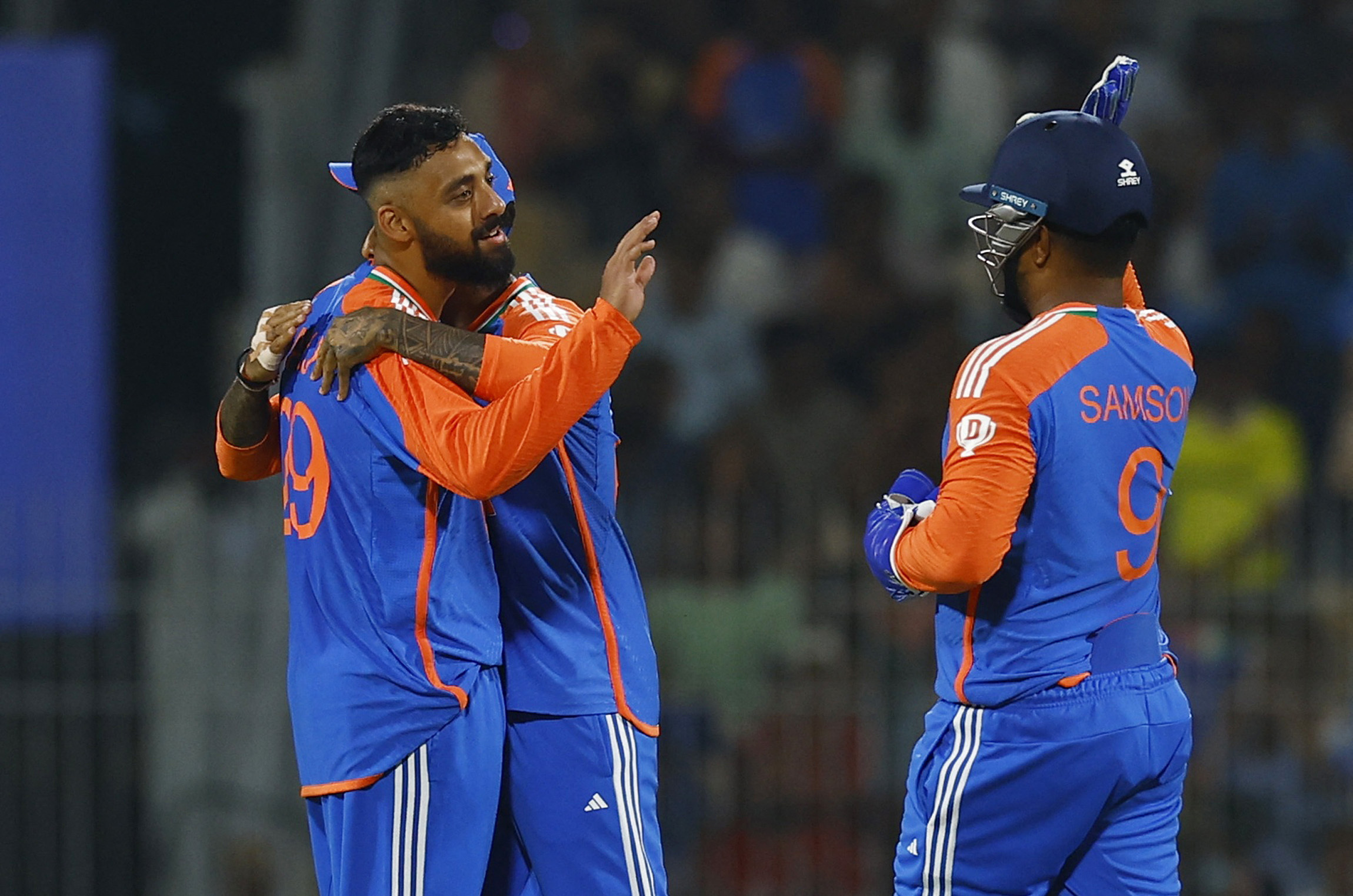 Cricket - Second T20 International - India v England - M. A. Chidambaram Stadium, Chennai, India - January 25, 2025 India's Varun Chakravarthy celebrates with Suryakumar Yadav and Sanju Samson after taking the wicket of England's Harry Brook REUTERS/Anushree Fadnavis