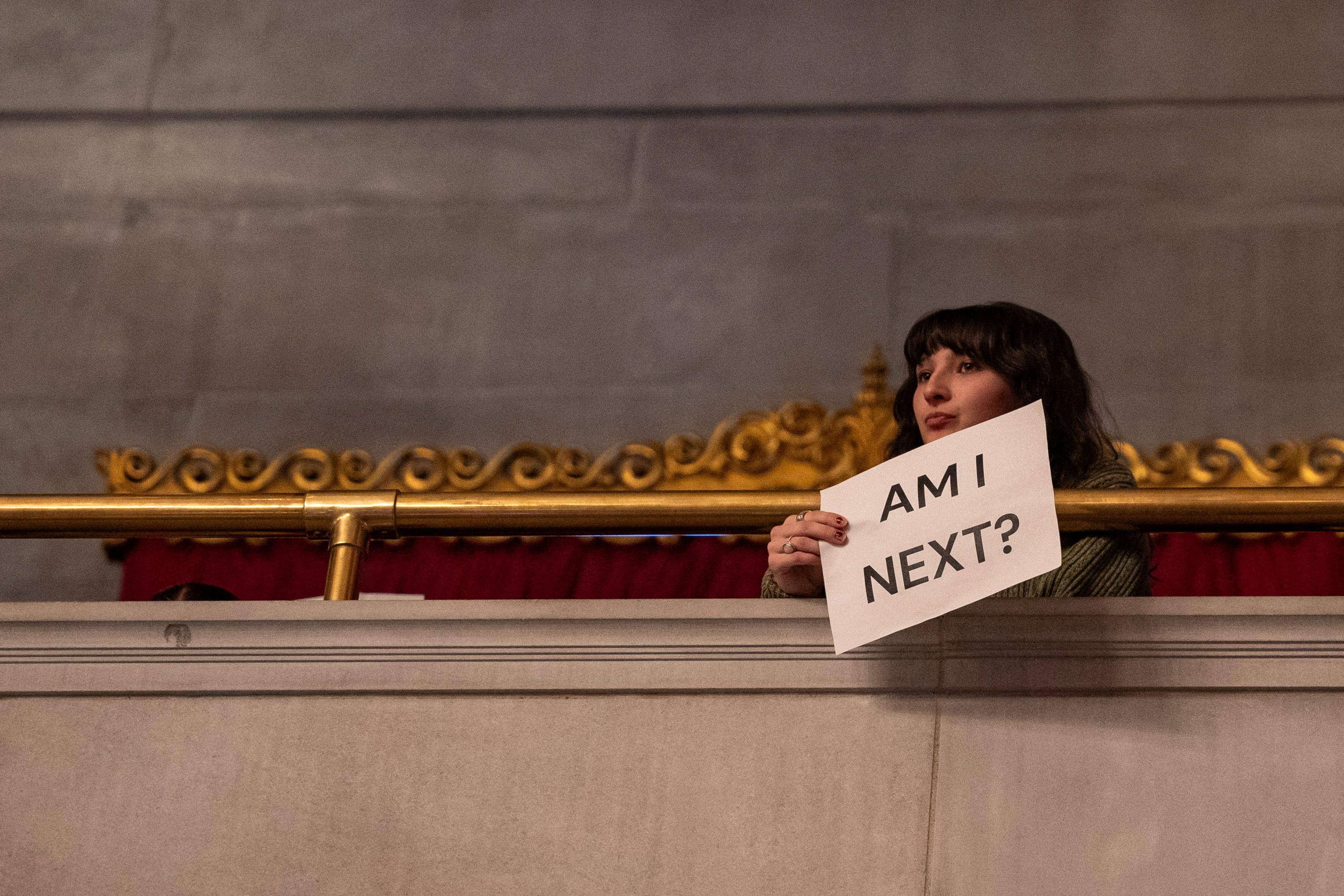 A student holds a sign during a special legislative session focused on a universal school voucher program and immigration reforms supporting U.S. President Donald Trump’s policies