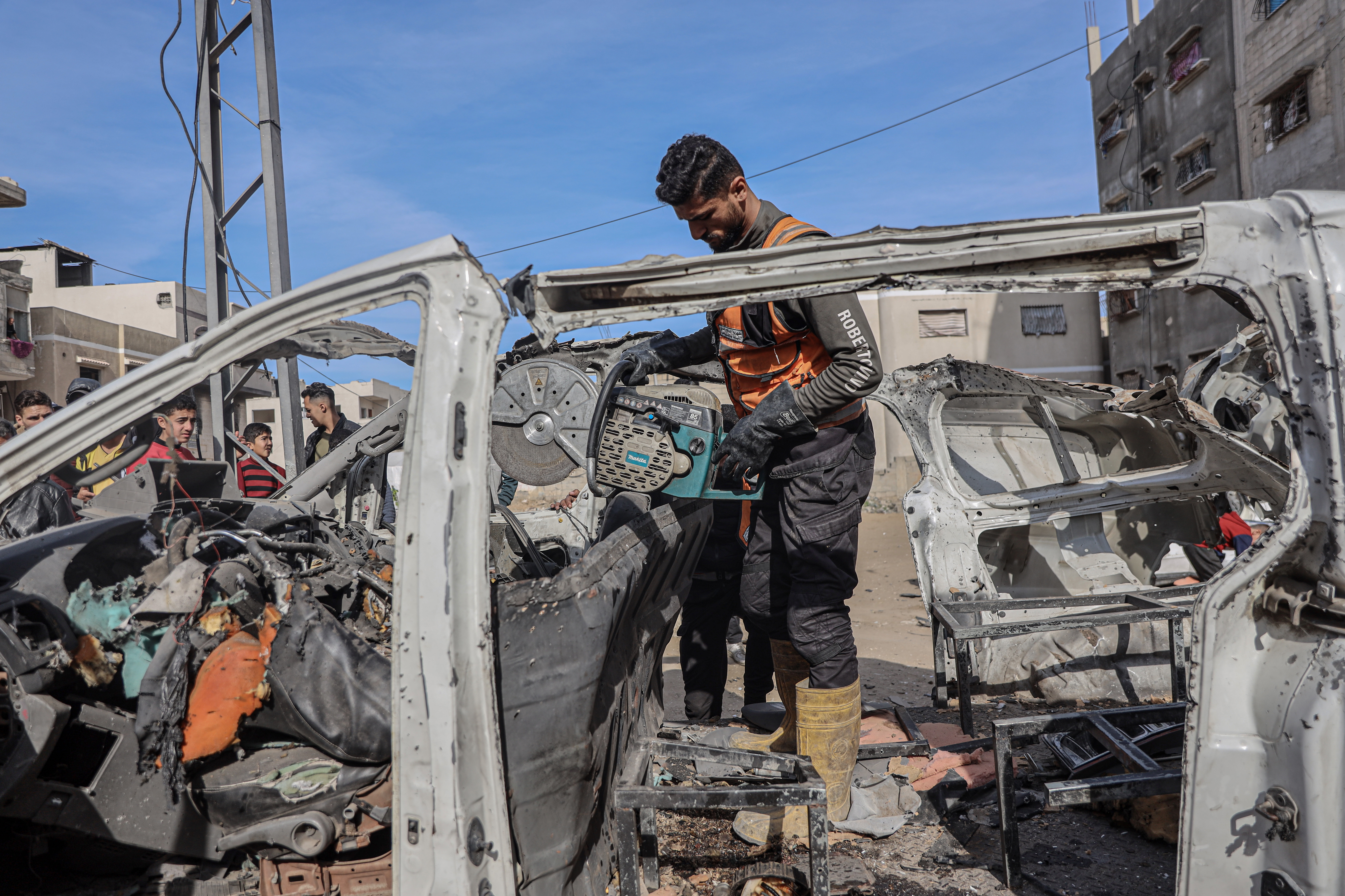 Man stands in skeleton of a vehicle 