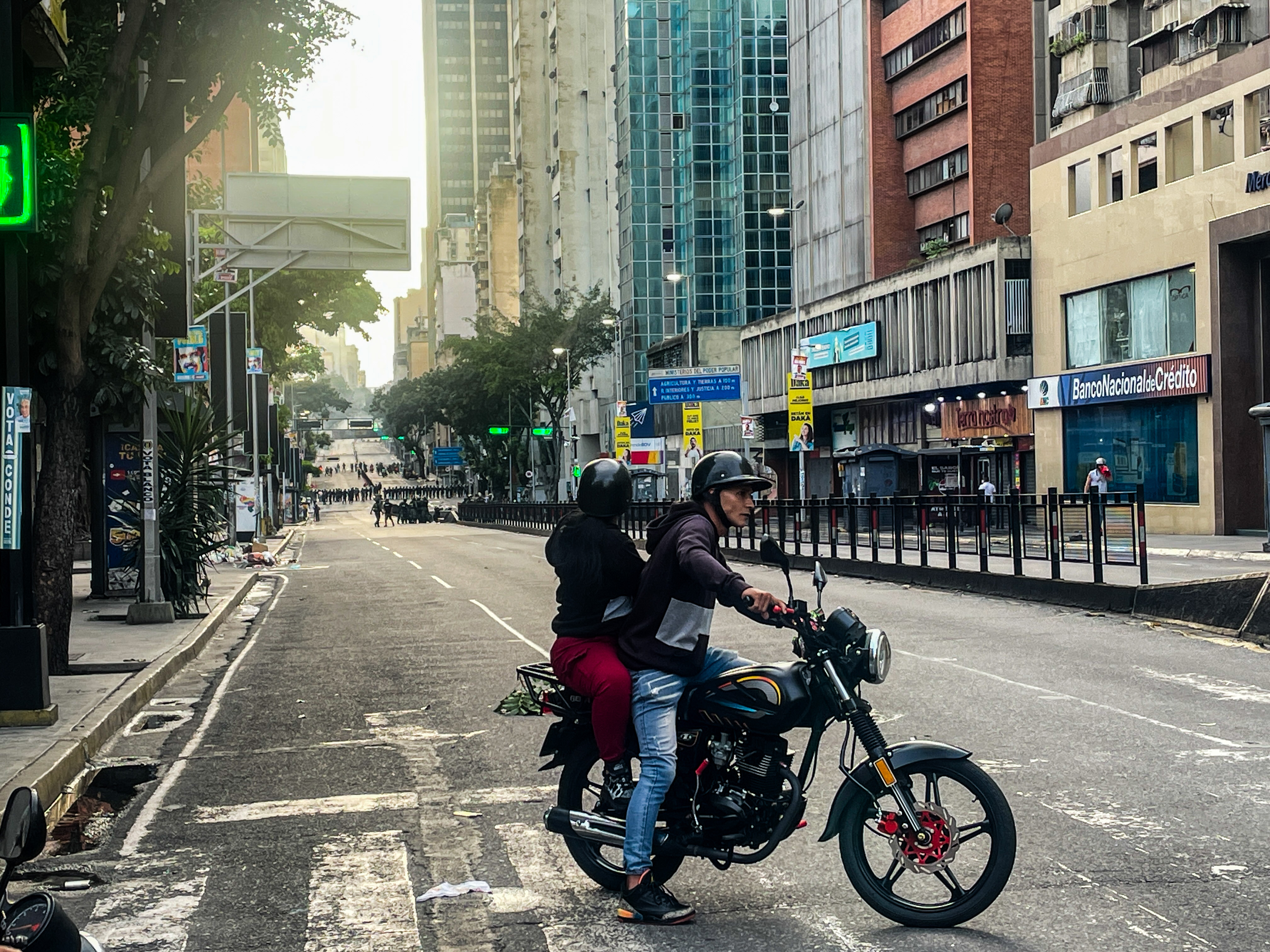 A couple turn around after road blocked by regime forces during post election protests on 29 July