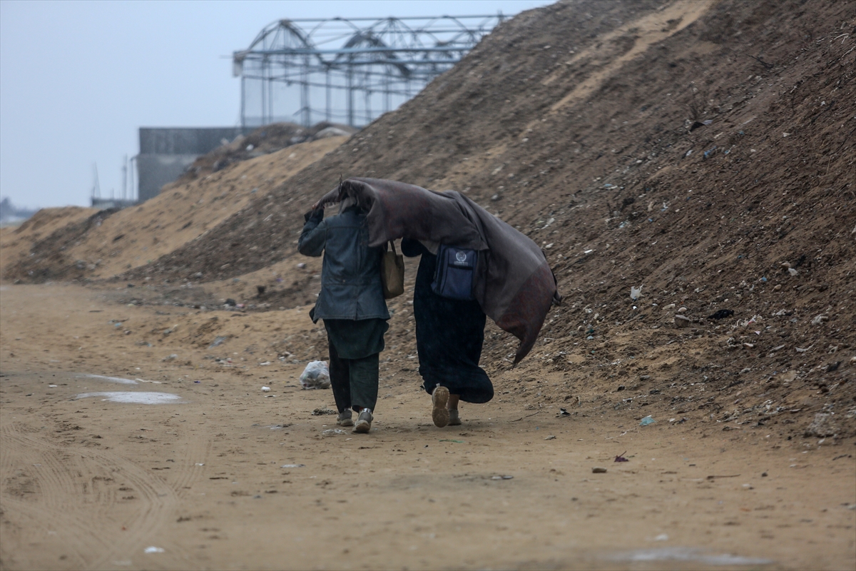 : Palestinians continue to live in makeshift tents, struggling with bad weather conditions especially heavy rains in Khan Yunis, Gaza on December 31, 2024. Heavy rains in the Gaza Strip, where Israel continues its attacks, caused floods in tent camps where thousands of people took shelter. Due to the rain, the tent camp in the city of Khan Yunis in the central part of the Gaza Strip was flooded, while Palestinians continue to live in makeshift tents struggling with bad weather conditions. Photojournalist:Abed Rahim Khatib