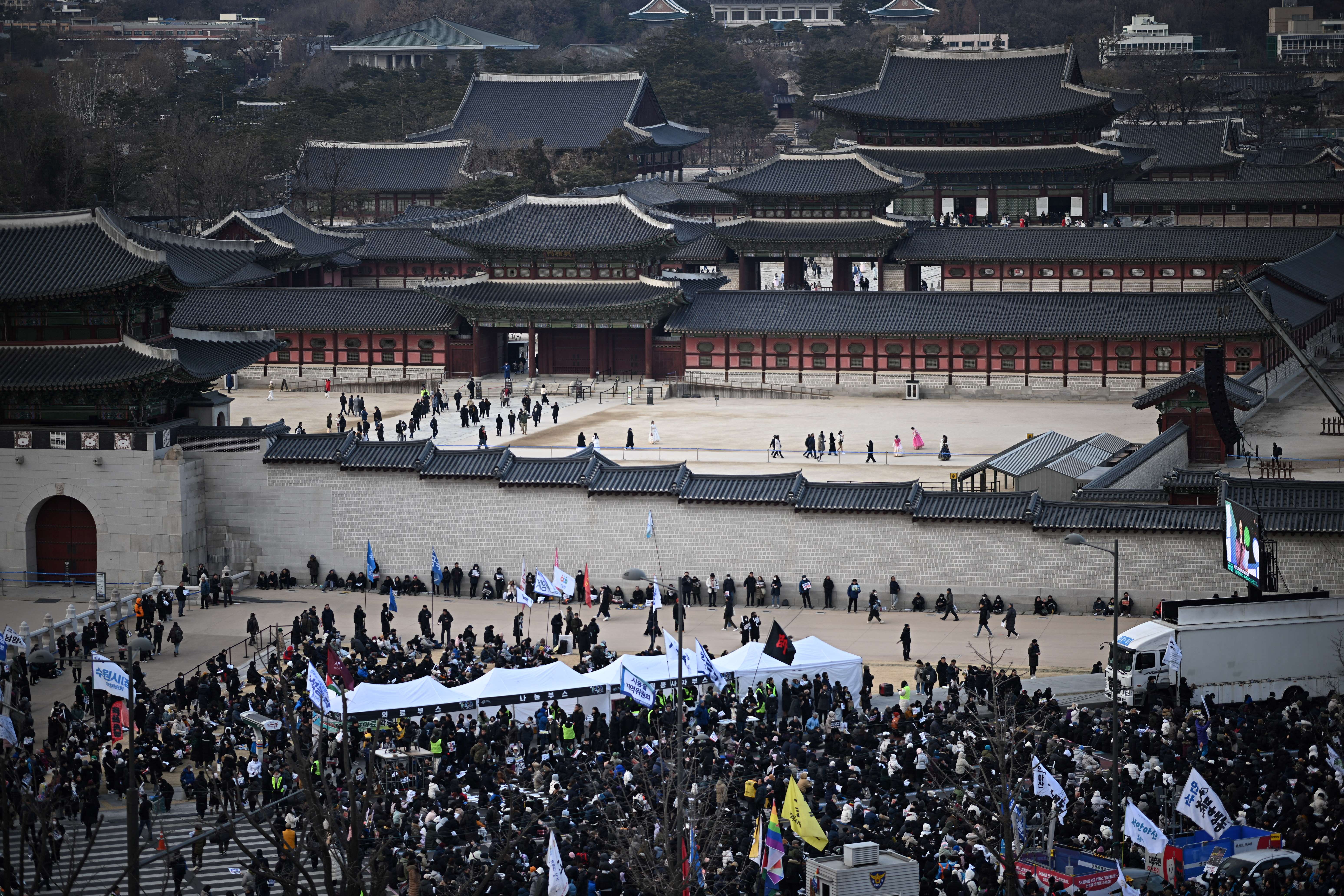 People gather for a rally to protest against impeached South Korea's president Yoon Suk Yeol