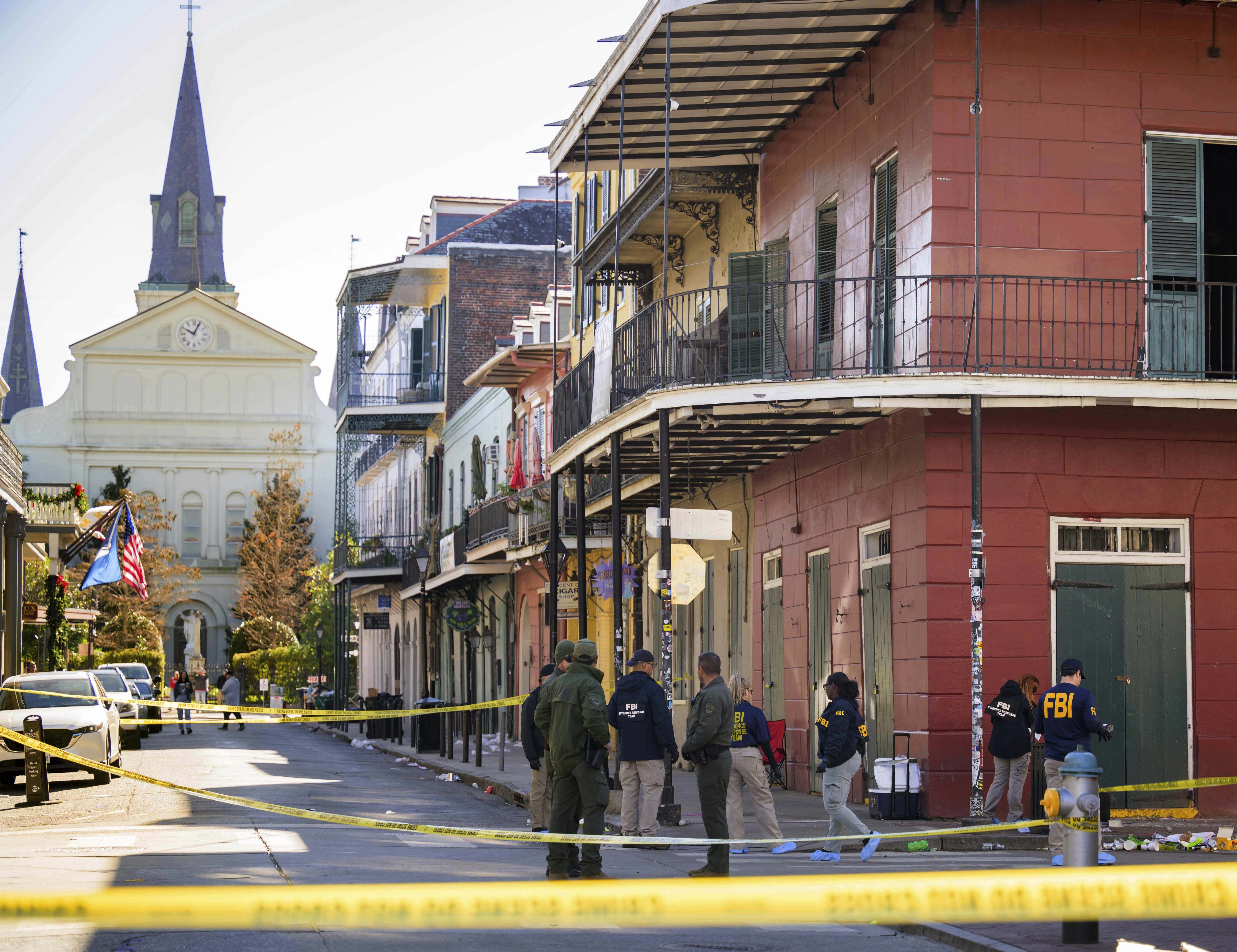 A view of Bourbon Street, cordoned off by yellow police tape as investigators examine the scene.