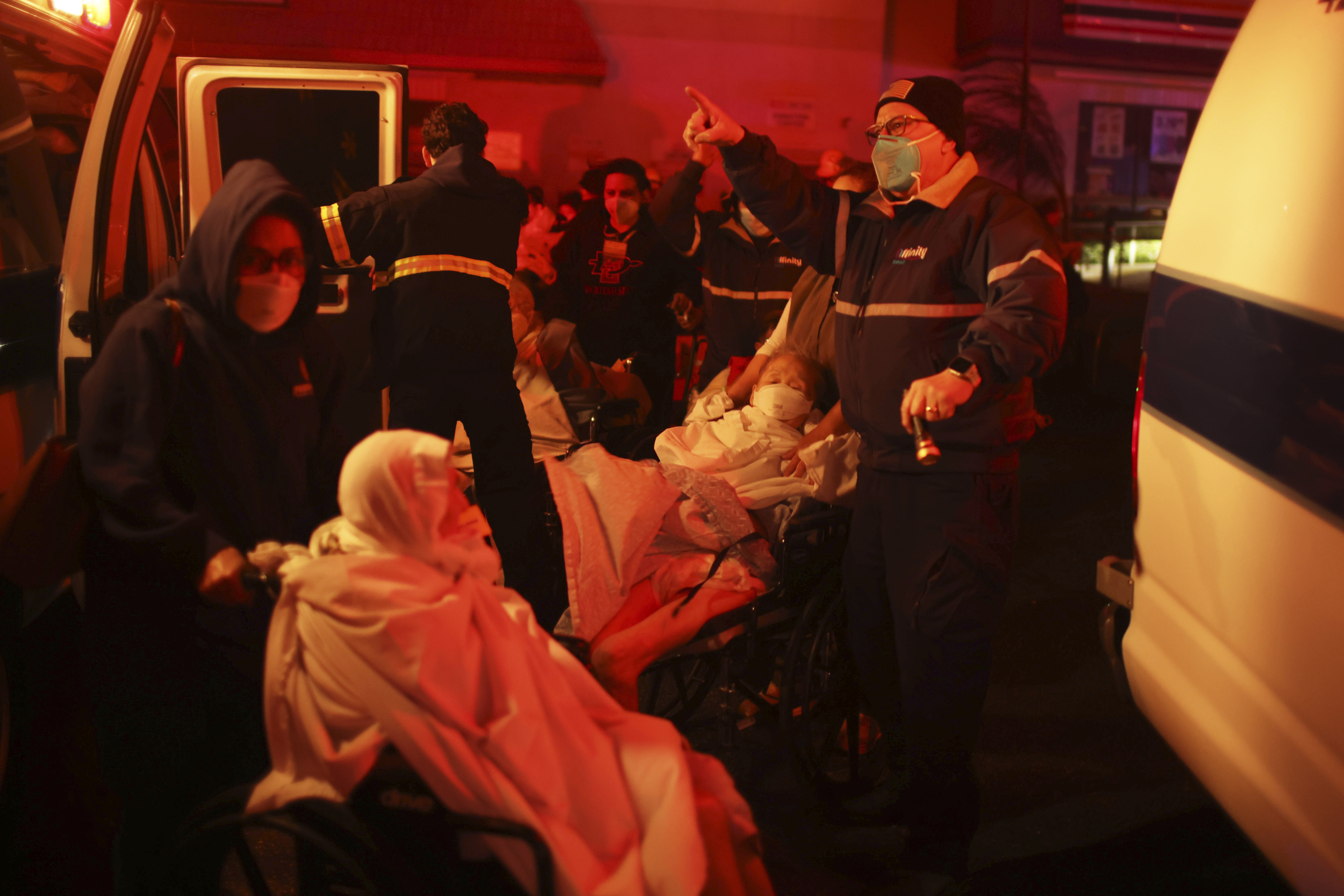 Residents of a senior center are evacuated as the Eaton Fire approaches Tuesday, Jan. 7, 2025 in Altadena