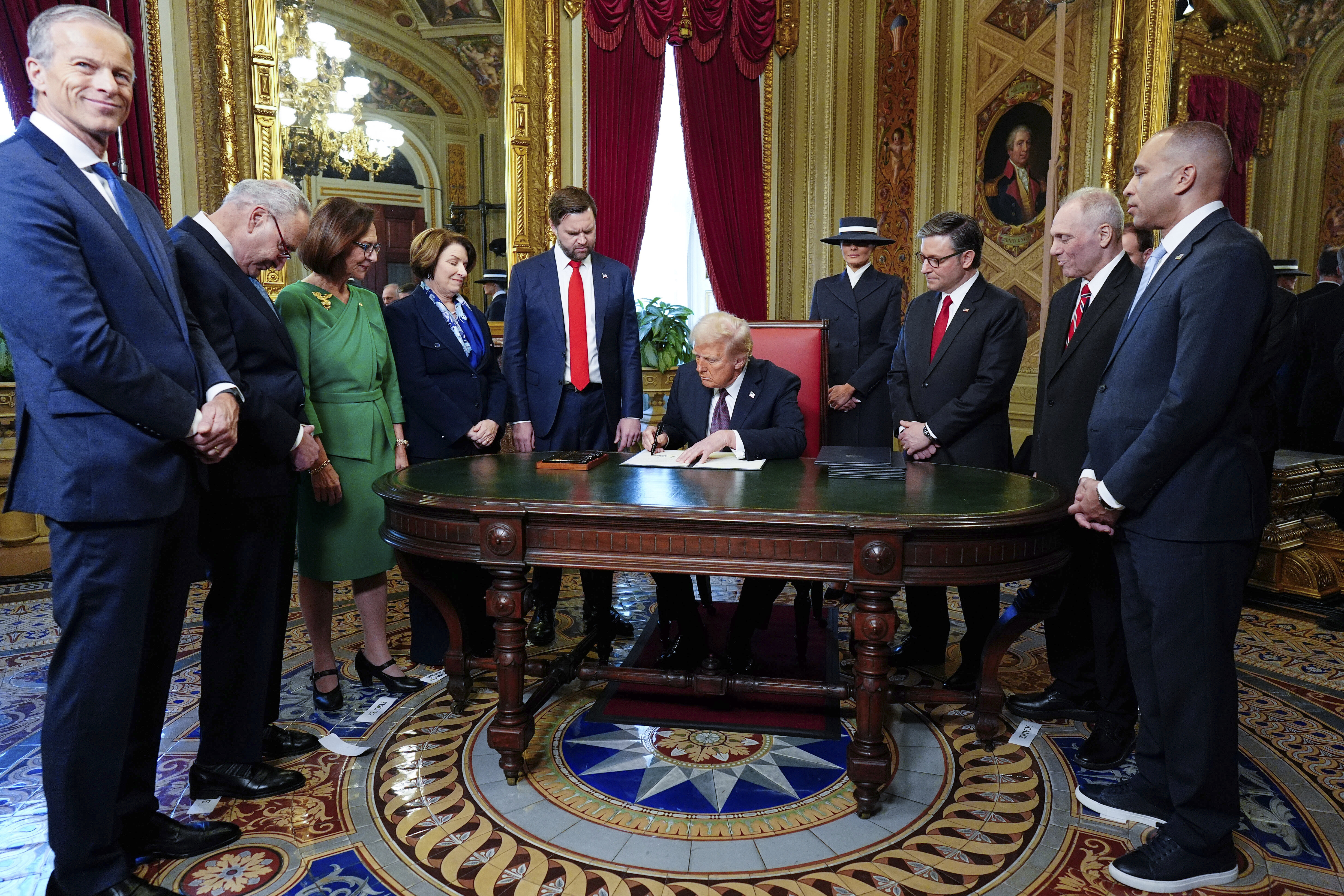 Donald Trump presides over a signing ceremony