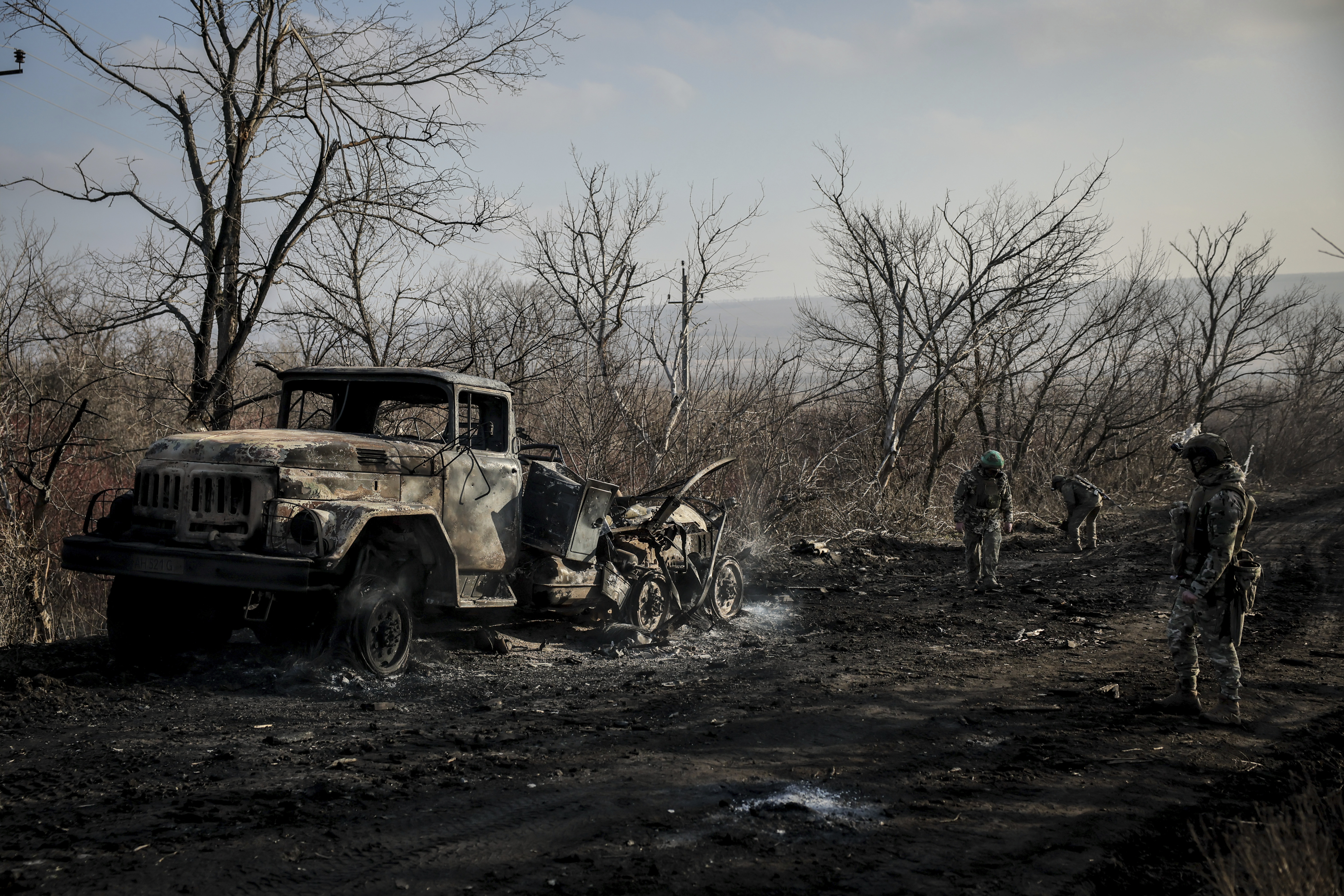 FILE - Ukrainian servicemen collect damaged ammunition on the road at the front line near Chasiv Yar town, in Donetsk region, Ukraine, on Jan. 10, 2025. (Oleg Petrasiuk/Ukraine's 24th Mechanised Brigade via AP, File)