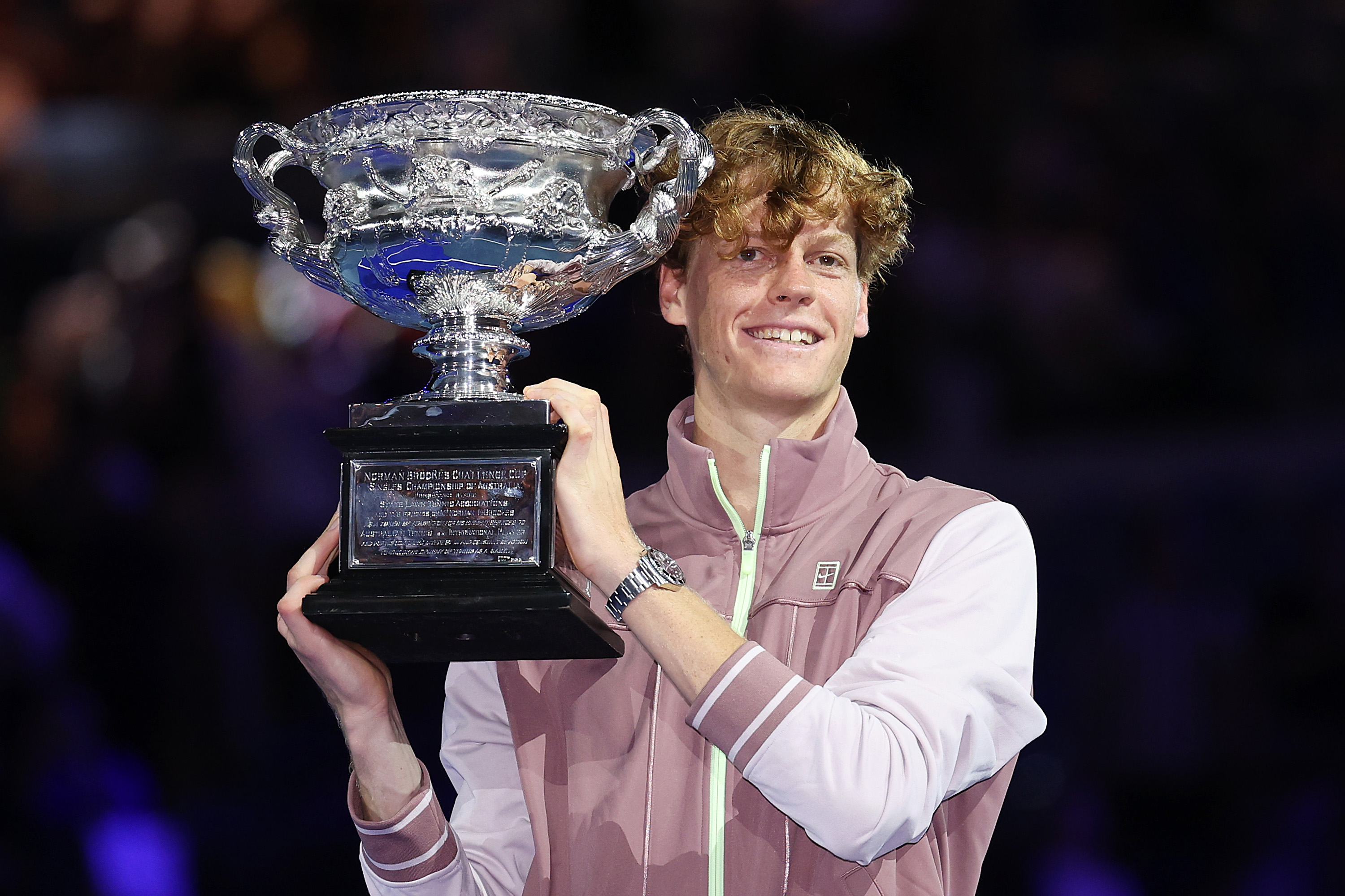 MELBOURNE, AUSTRALIA - JANUARY 28: Jannik Sinner of Italy poses with the Norman Brookes Challenge Cup during the official presentation after their Men's Singles Final match against Daniil Medvedev during the 2024 Australian Open at Melbourne Park on January 28, 2024 in Melbourne, Australia. (Photo by Daniel Pockett/Getty Images)