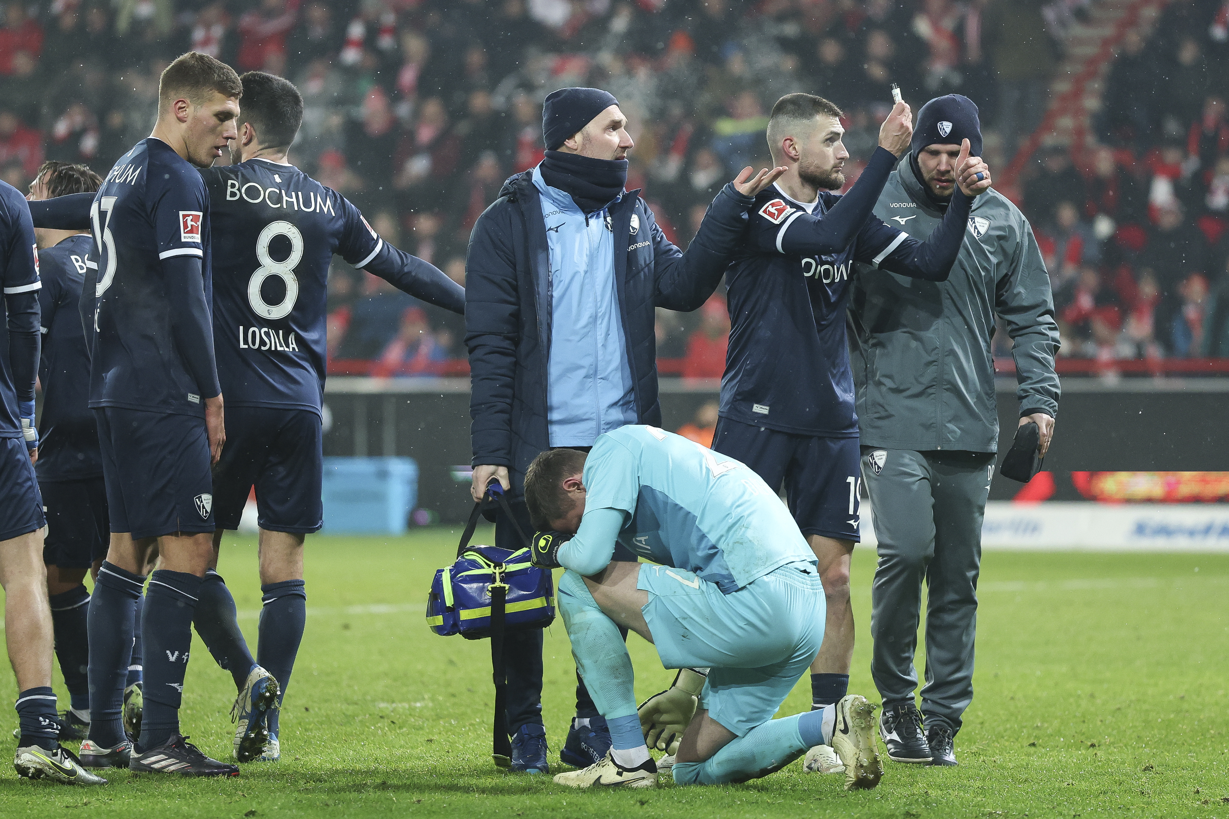 BERLIN, GERMANY - DECEMBER 14: Patrick Drewes of VfL Bochum reacts after he was hit by lighter from a fan during the Bundesliga match between 1. FC Union Berlin and VfL Bochum 1848 at Stadion An der Alten Foersterei on December 14, 2024 in Berlin, Germany. (Photo by Maja Hitij/Getty Images)