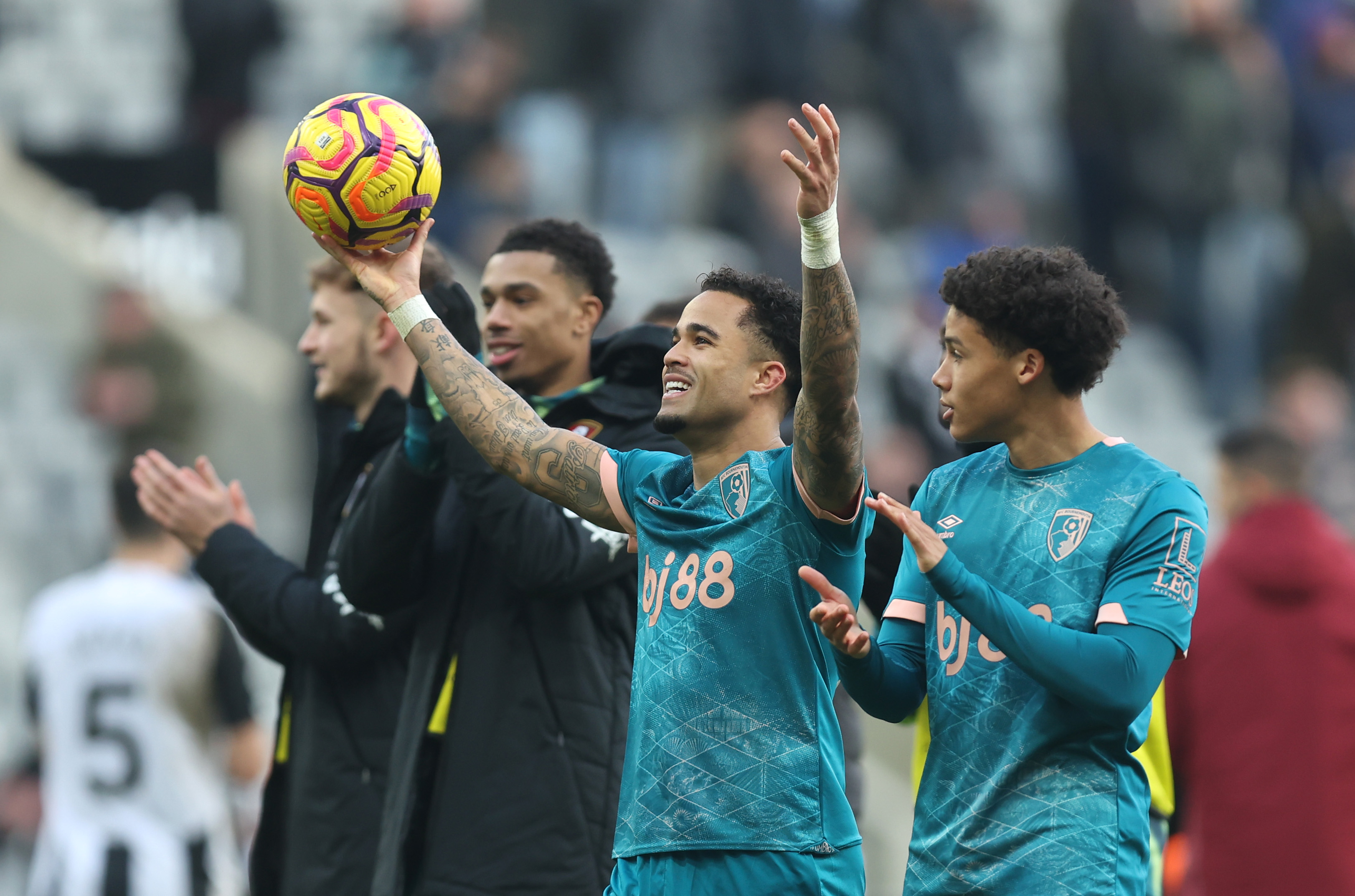 NEWCASTLE UPON TYNE, ENGLAND - JANUARY 18: Justin Kluivert of AFC Bournemouth holds the match ball as he acknowledges the fans at the end of the Premier League match between Newcastle United FC and AFC Bournemouth at St James' Park on January 18, 2025 in Newcastle upon Tyne, England. (Photo by George Wood/Getty Images)