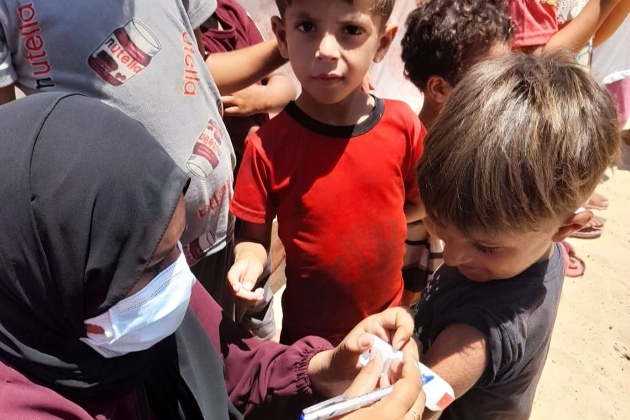 The author conducting malnutrition monitoring in a displacement camp in Khan Younis in July 2024