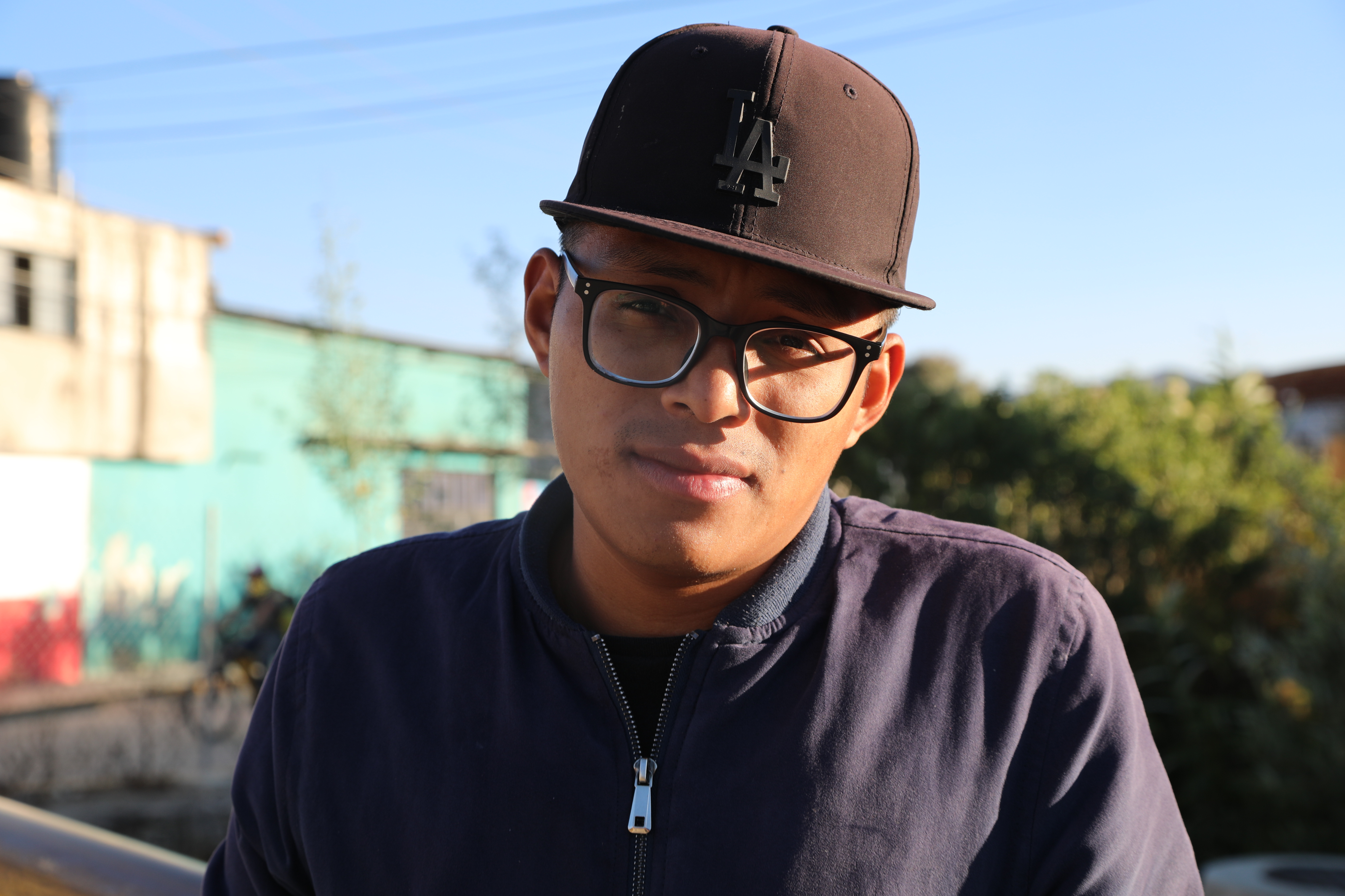 Ismail Jimenez in a black baseball cap