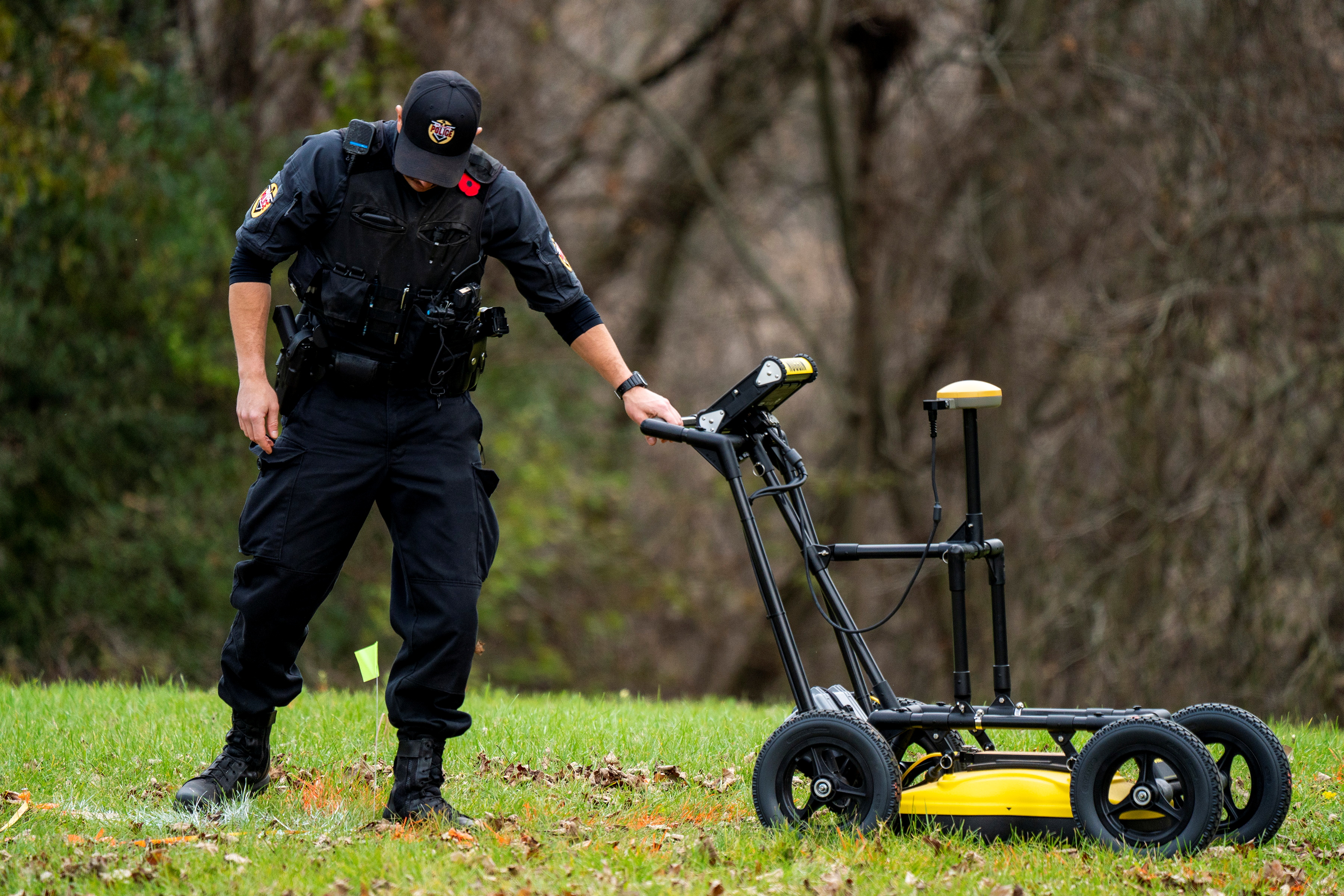 A police officer uses ground-penetrating radar in a search for unmarked graves at the Mohawk Institute, a former residential school in Brantford, Ontario