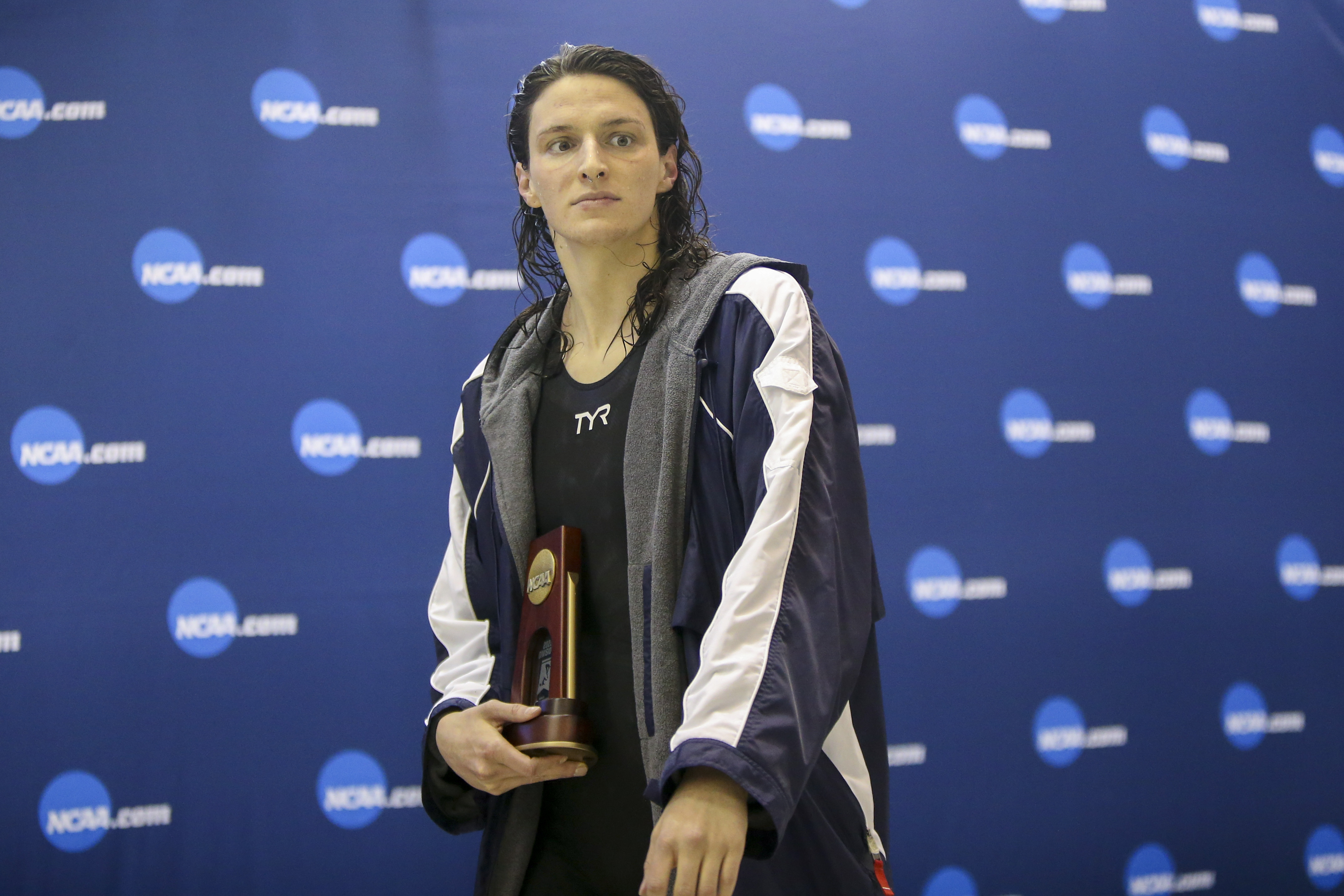 Mar 18, 2022; Atlanta, Georgia, USA; Penn Quakers swimmer Lia Thomas holds a trophy after finishing fifth in the 200 free at the NCAA Swimming & Diving Championships at Georgia Tech. Mandatory Credit: Brett Davis-USA TODAY Sports