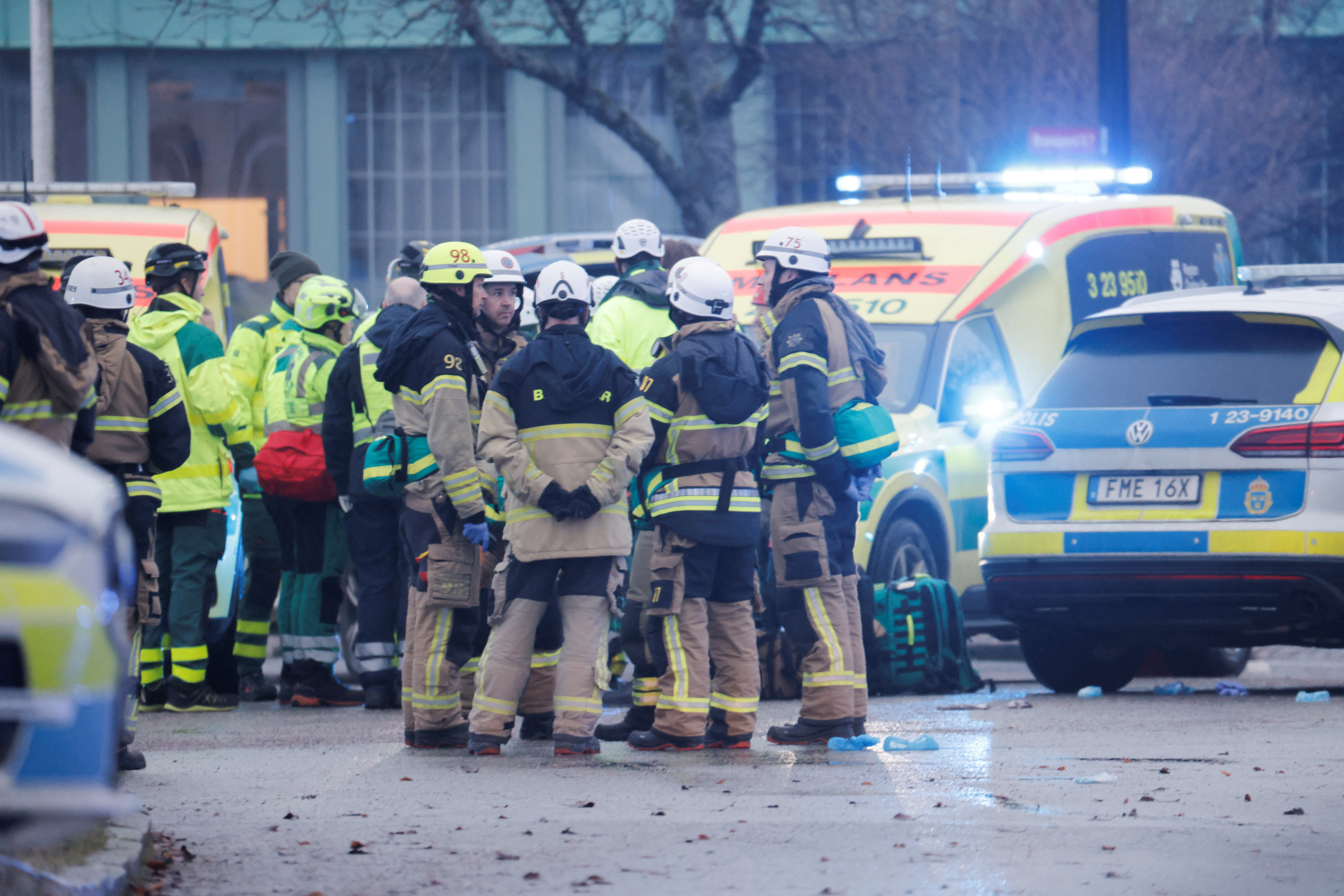 Emergency personnel and police officers work at the adult education center Campus Risbergska school after a shooting attack in Orebro