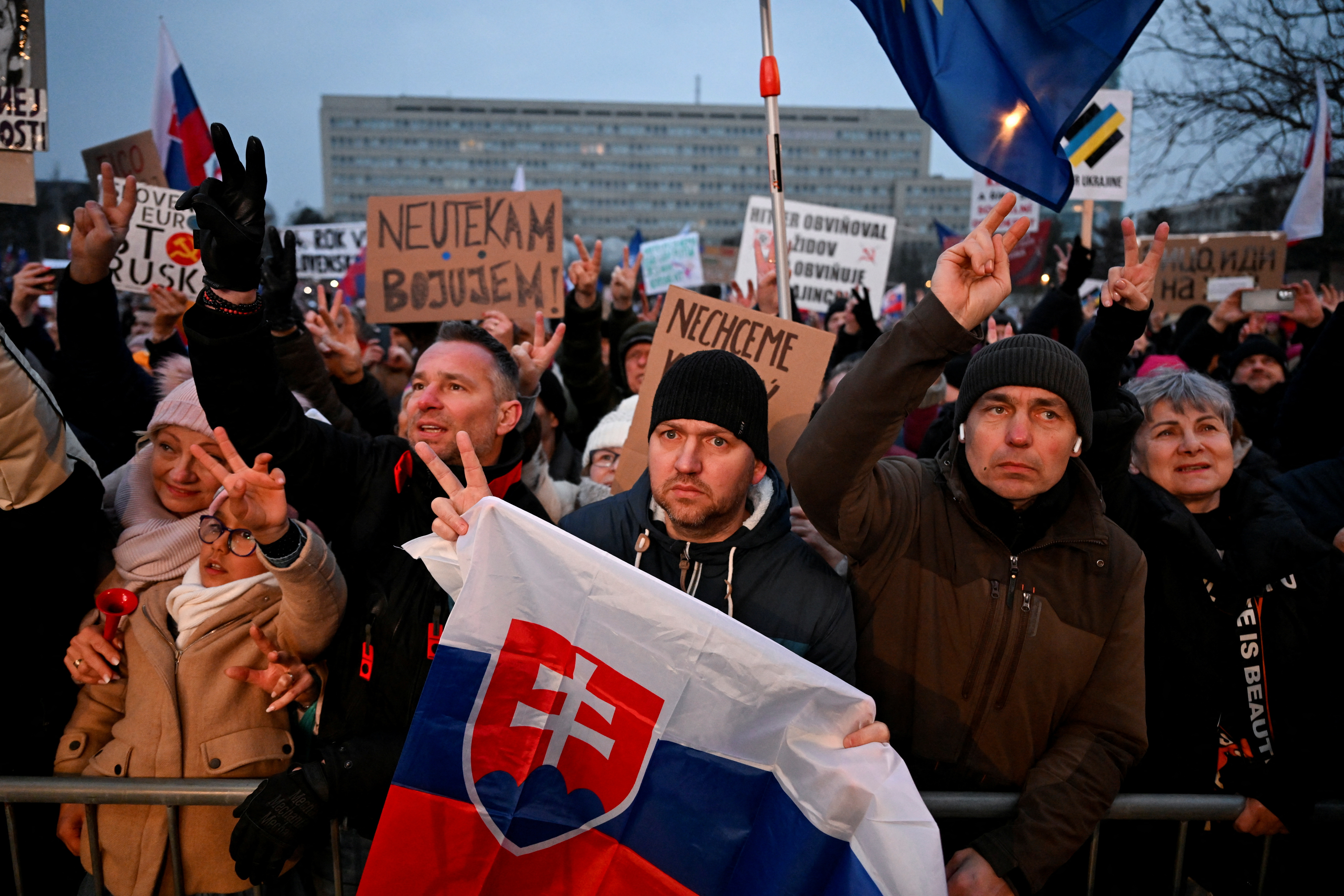 Protesters hold a Slovakian flag