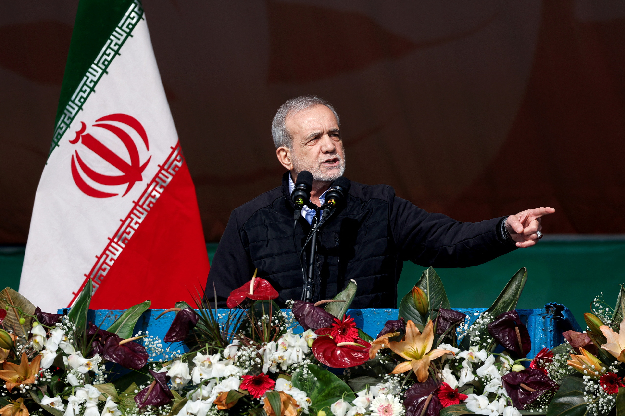 Iranian President Masoud Pezeshkian speaks during the 46th anniversary of the Islamic Revolution in Tehran, Iran