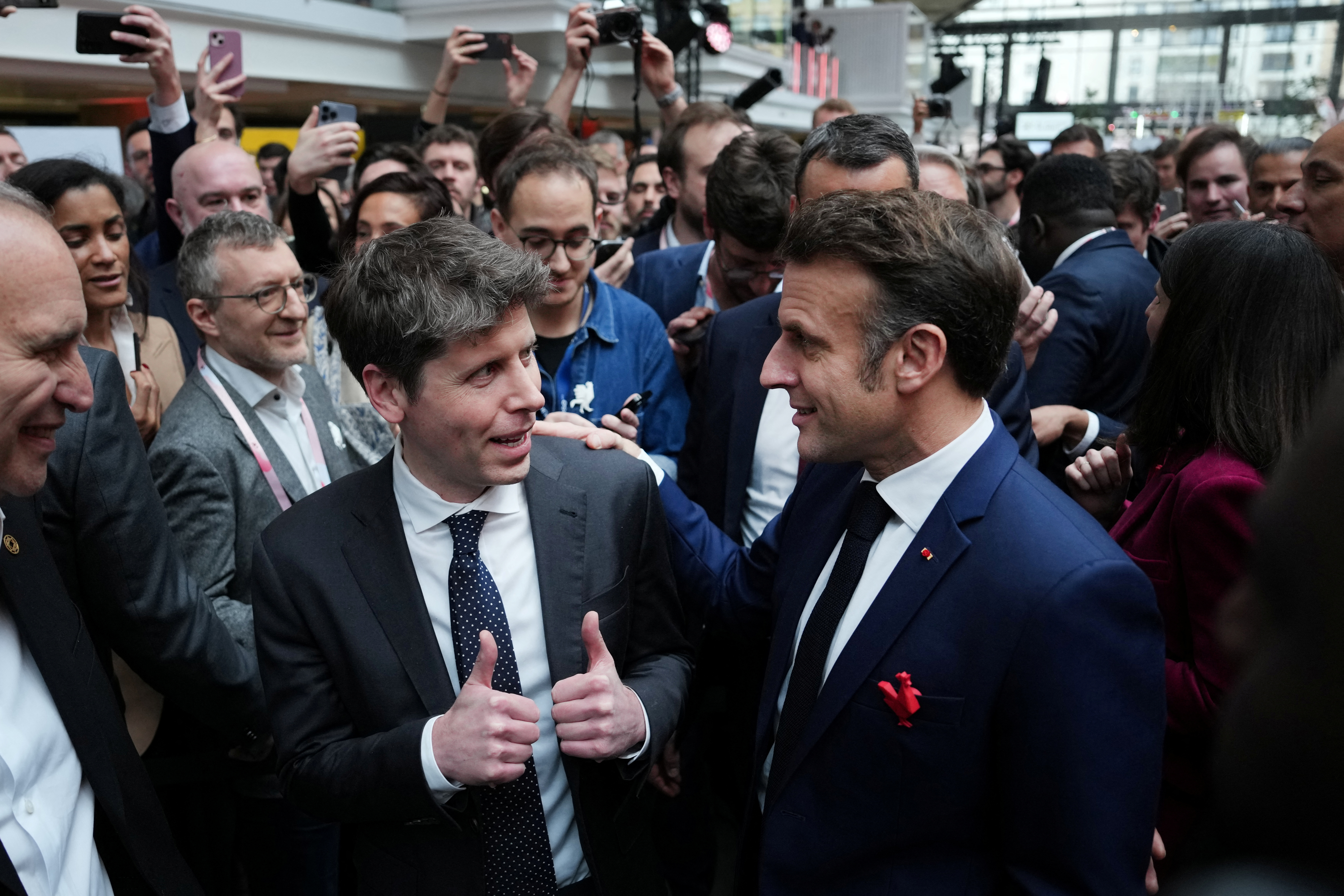 Sam Altman, CEO of OpenAI speaks with French President Emmanuel Macron at Station F, during an event on the sidelines of the Artificial Intelligence Action Summit in Paris, France, Feb. 11, 2025. Aurelien Morissard/Pool via REUTERS