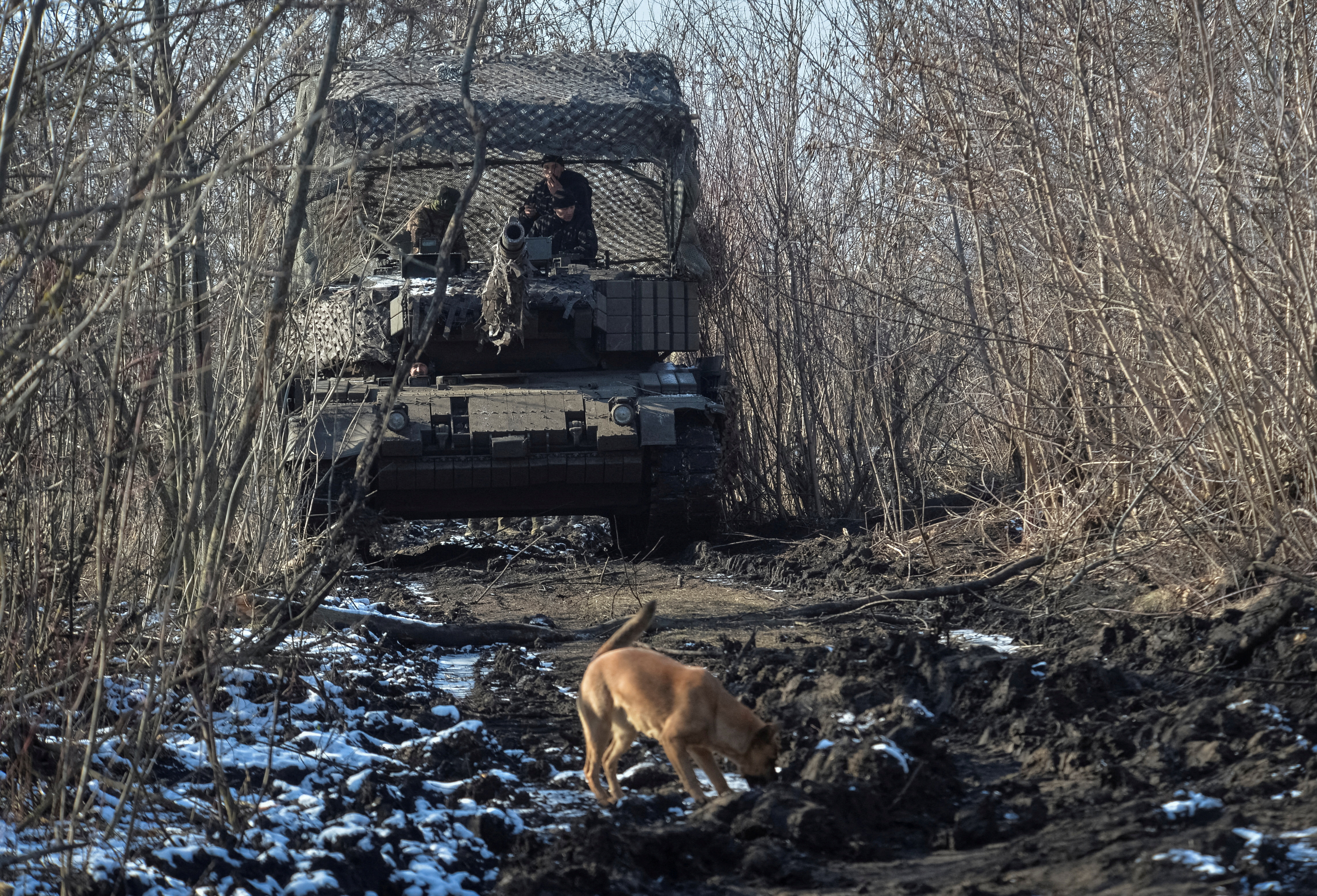 Servicemen of the 5th Separate Heavy Mechanised Brigade of the Ukrainian Armed Forces drive in a Leopard 1A5 tank, amid Russia's attack on Ukraine, in Donetsk region, Ukraine.