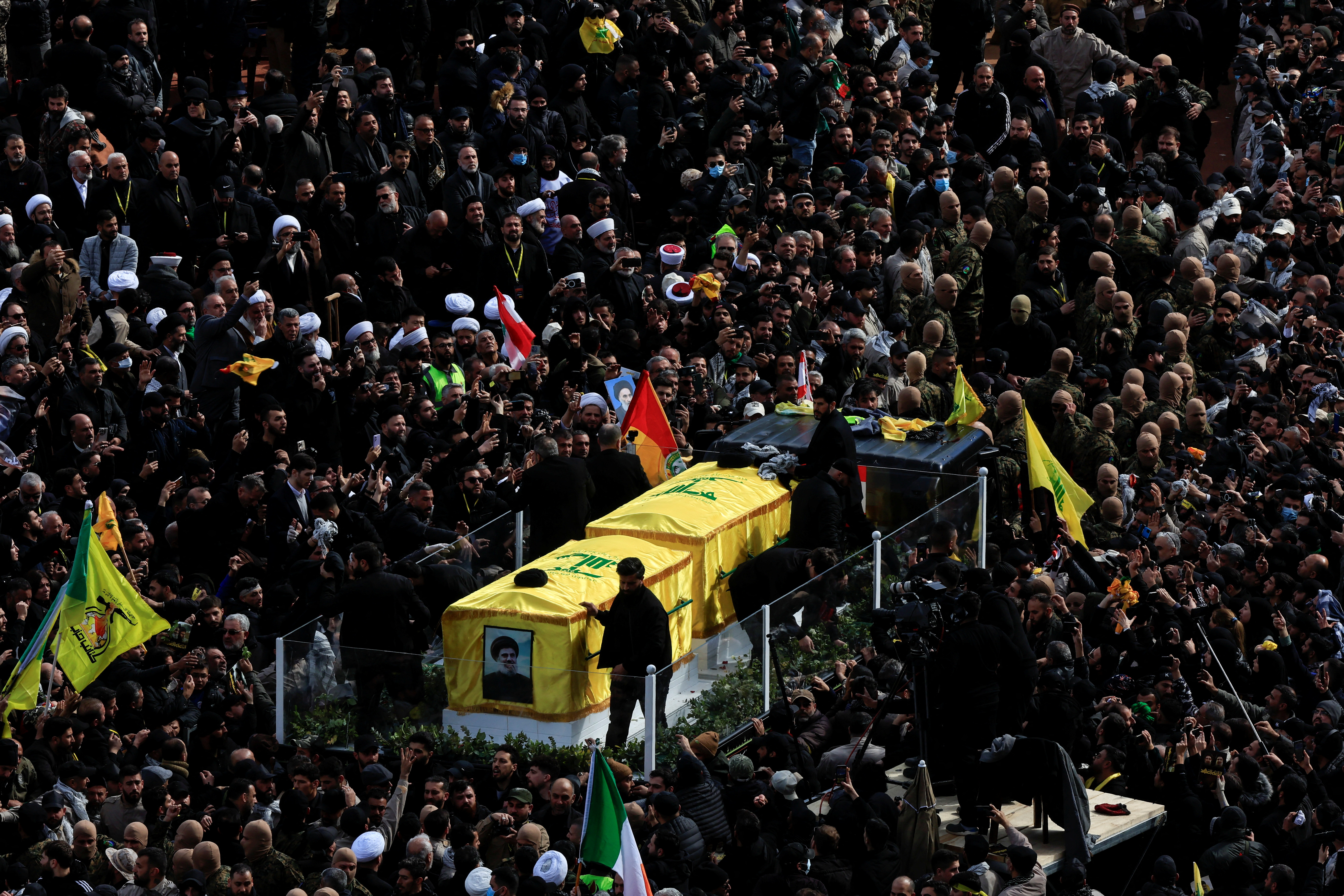 A vehicle carries the coffins of former Hezbollah leaders Hassan Nasrallah and Hashem Safieddine