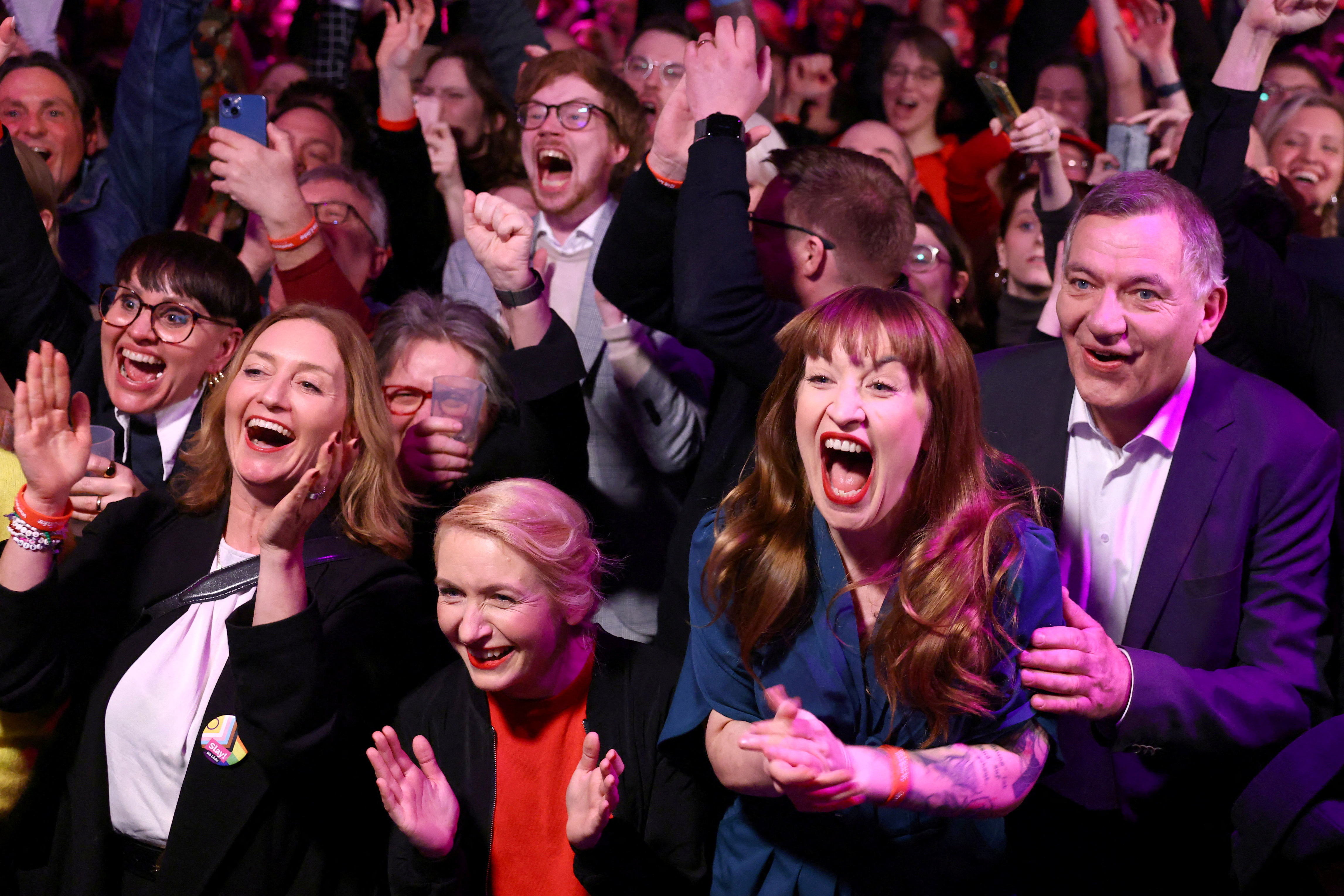 Co-party leaders of Germany's left-wing party The Left (Die Linke) Ines Schwerdtner and Jan van Aken, and Heidi Reichinnek, react after exit polls result.