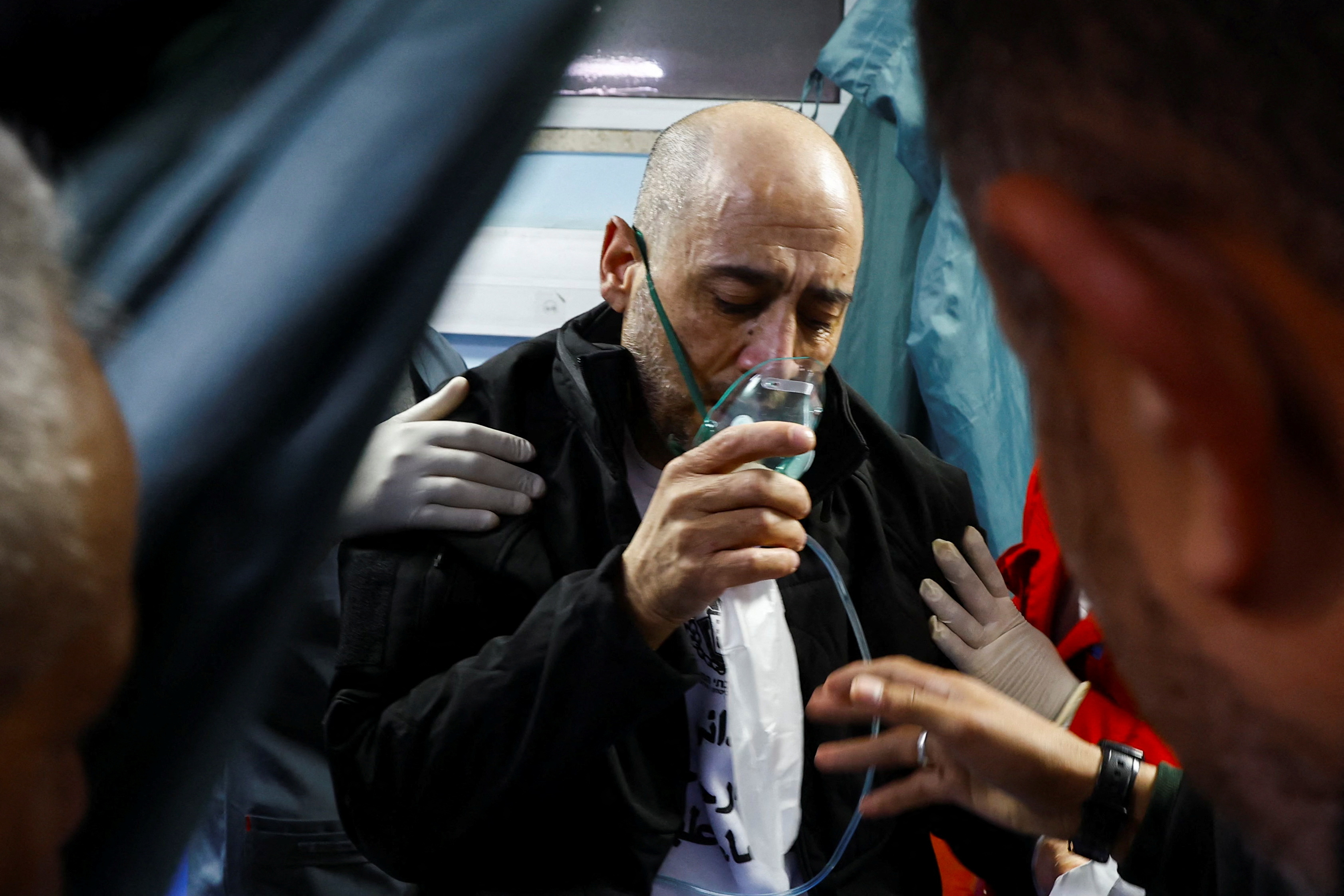 A freed Palestinian prisoner receives medical attention after being released from an Israeli jail