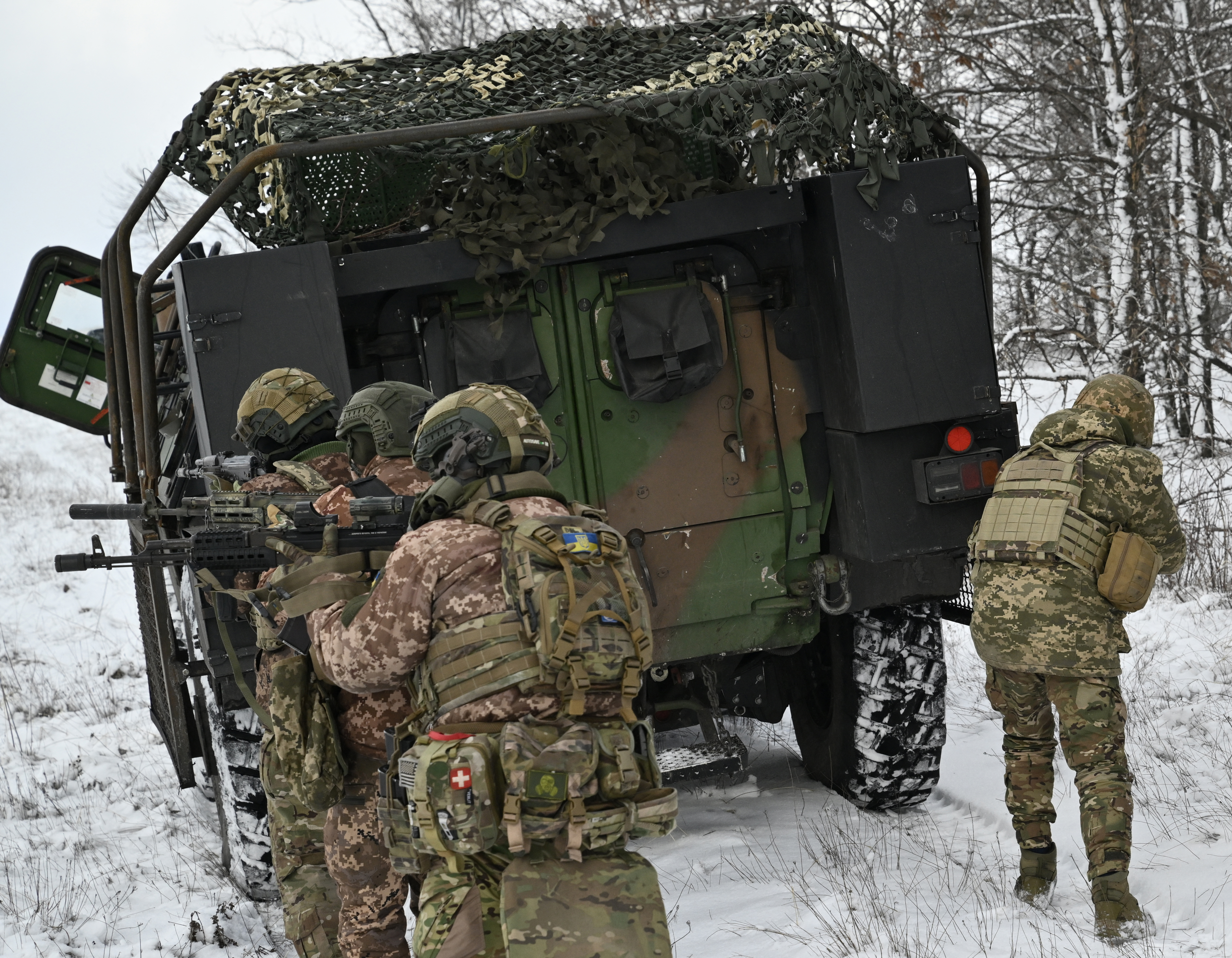 Ukrainian servicemen from the 24th Mechanised Brigade conduct field training with a French made VAB armoured personnel carrier, in the Donetsk region, on February 16, 2025 [Genya Savilov/AFP]