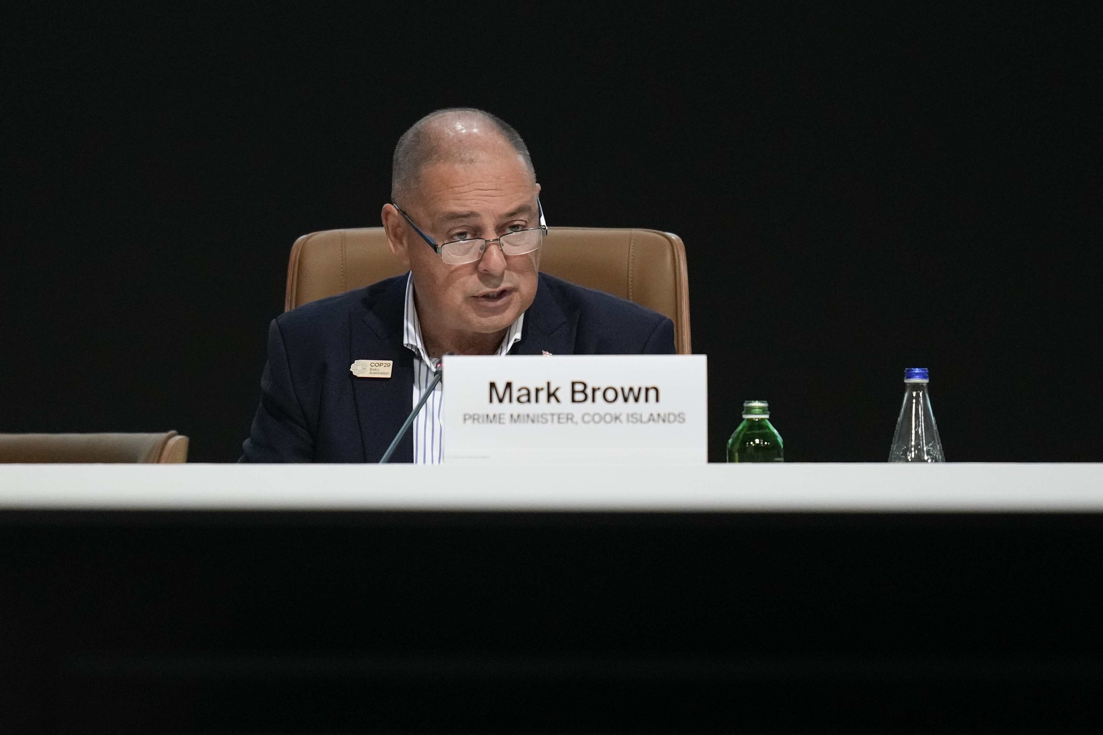 man at table speaking