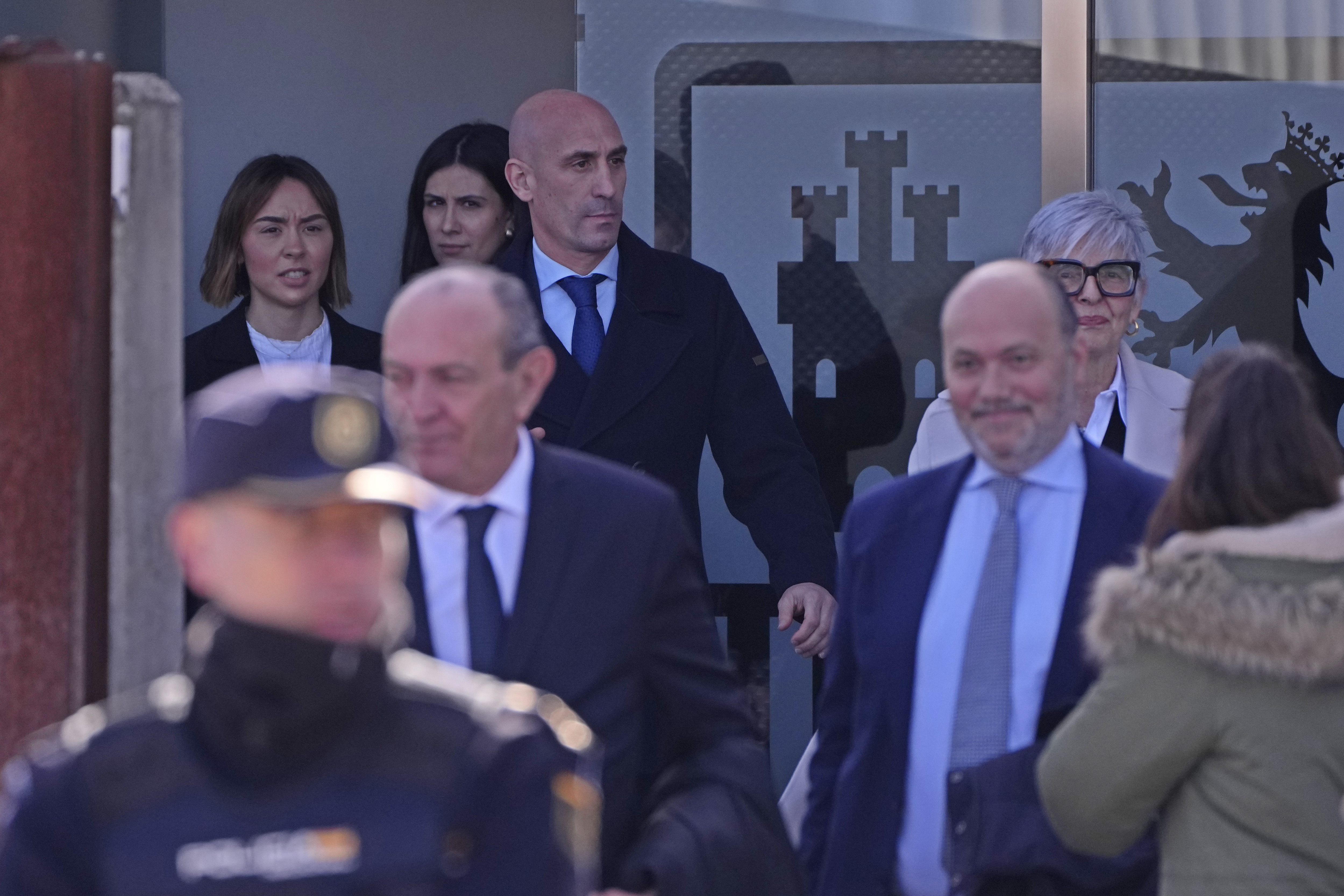 The former president of Spain's soccer federation Luis Rubiales, top, leaves a court on the outskirts of Madrid, Spain, Monday Feb. 3, 2025 where he is on trial for his unsolicited kiss on forward Jenni Hermoso. (AP Photo/Manu Fernandez)