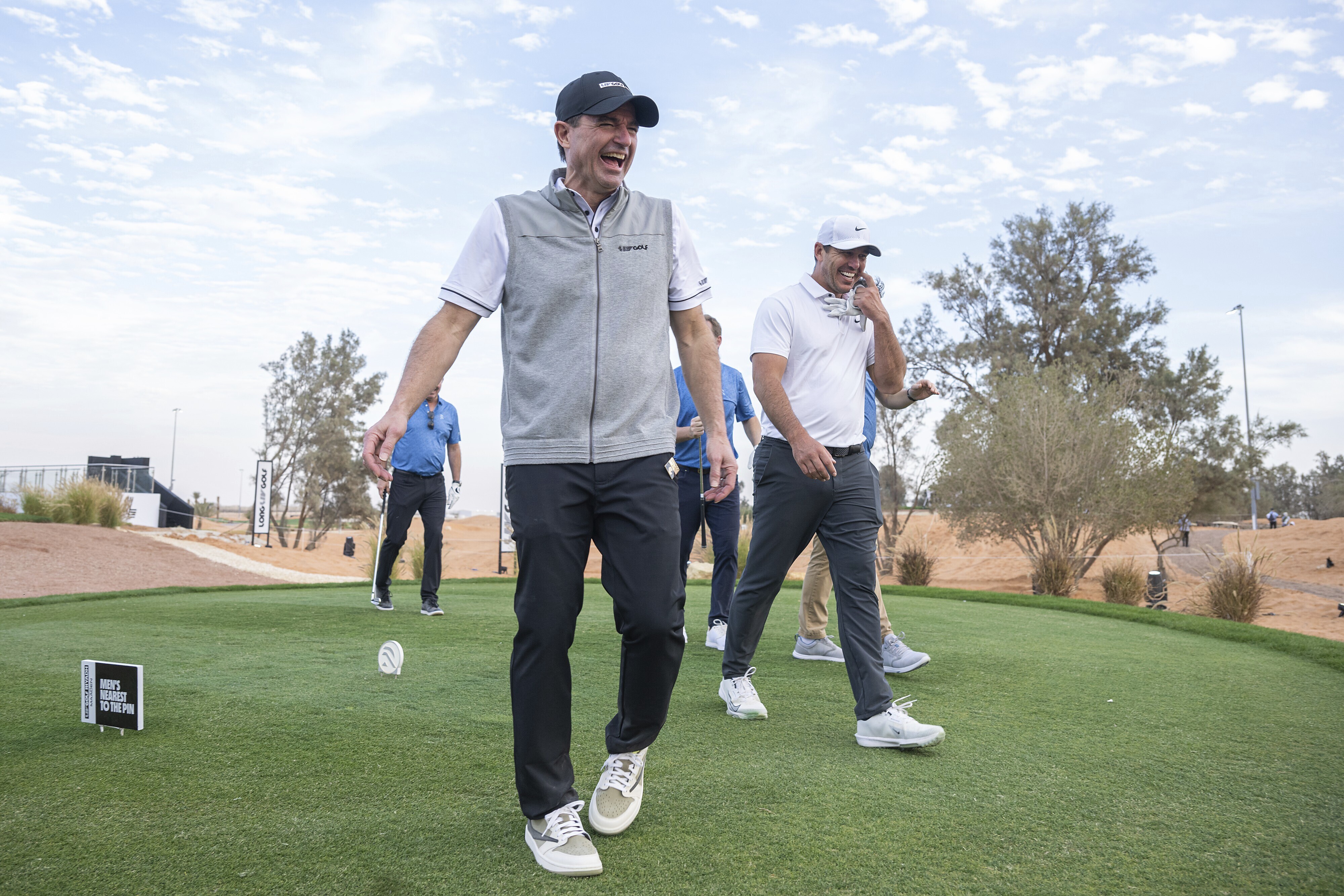 LIV Golf CEO, Scott O'Neil laughs while playing with Captain Brooks Koepka of Smash GC, Paul Danforth and Jordan Bazant during the pro-am before the start of LIV Golf Riyadh at Riyadh Golf Club on Wednesday, February 05, 2025 in Riyadh, Saudi Arabia. (Photo by Charles Laberge/LIV Golf via AP)