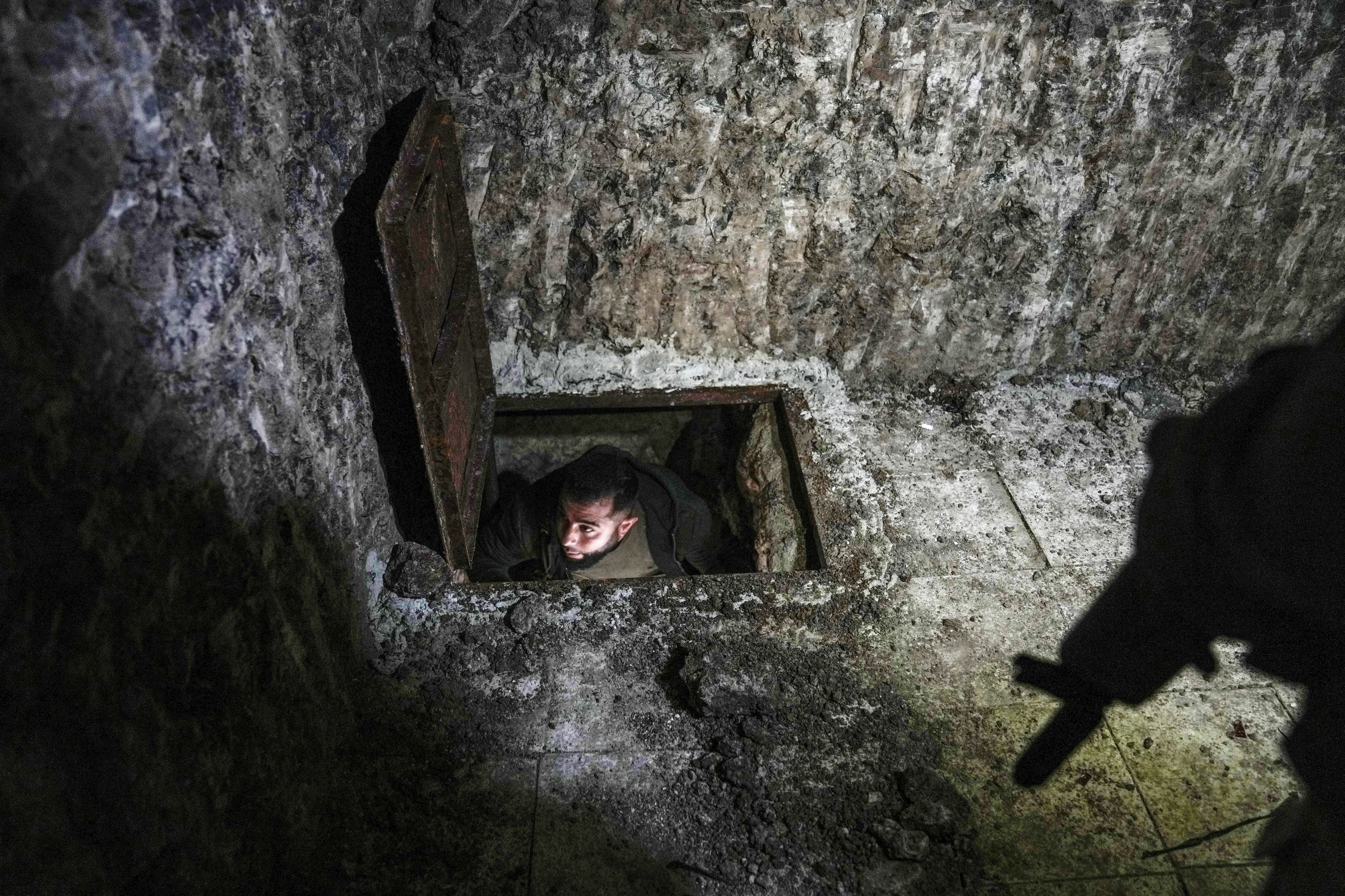 Syrians returning to the town of Tel Rifaat find homes in ruins and underground tunnels
