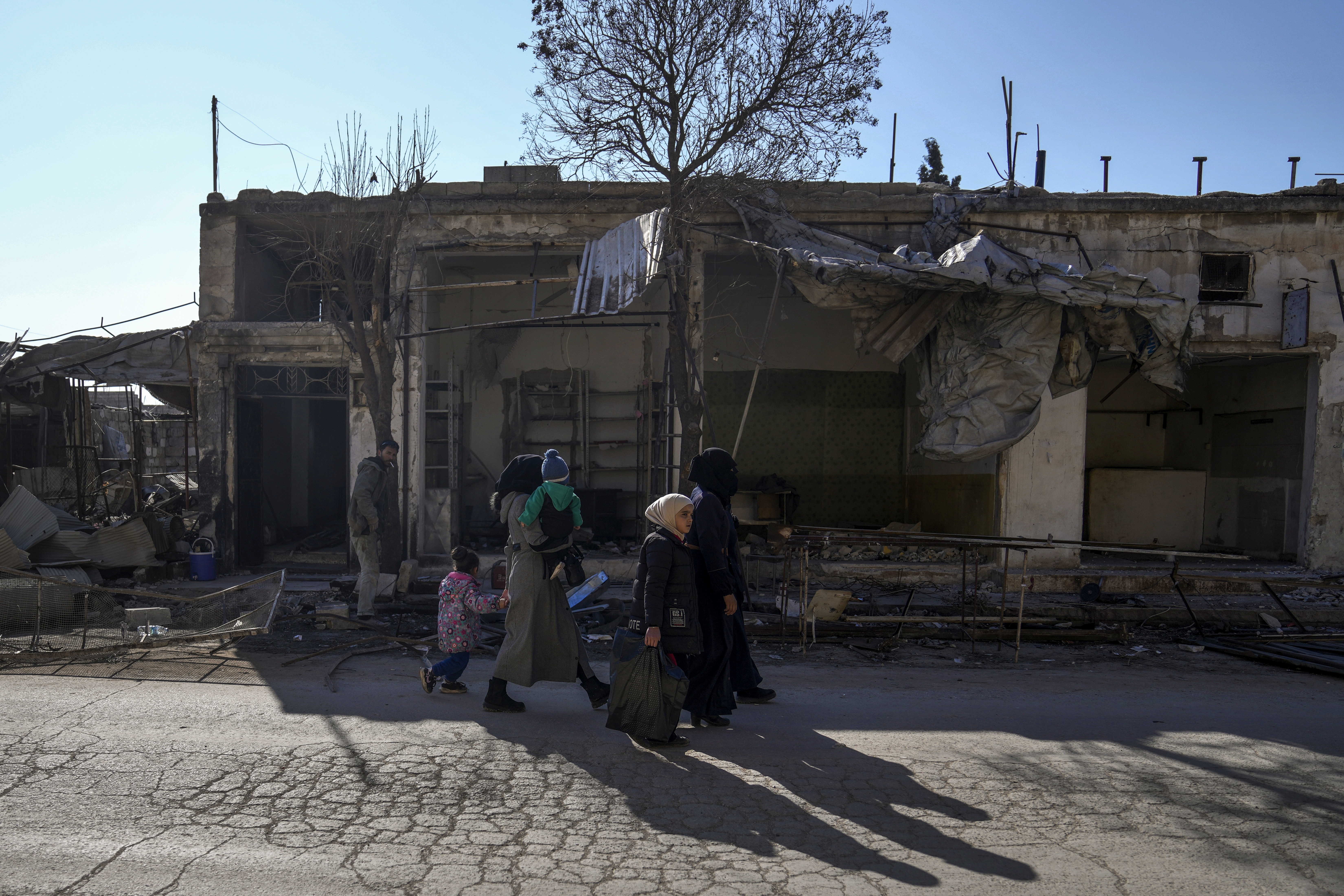 Syrians returning to the town of Tel Rifaat find homes in ruins and underground tunnels