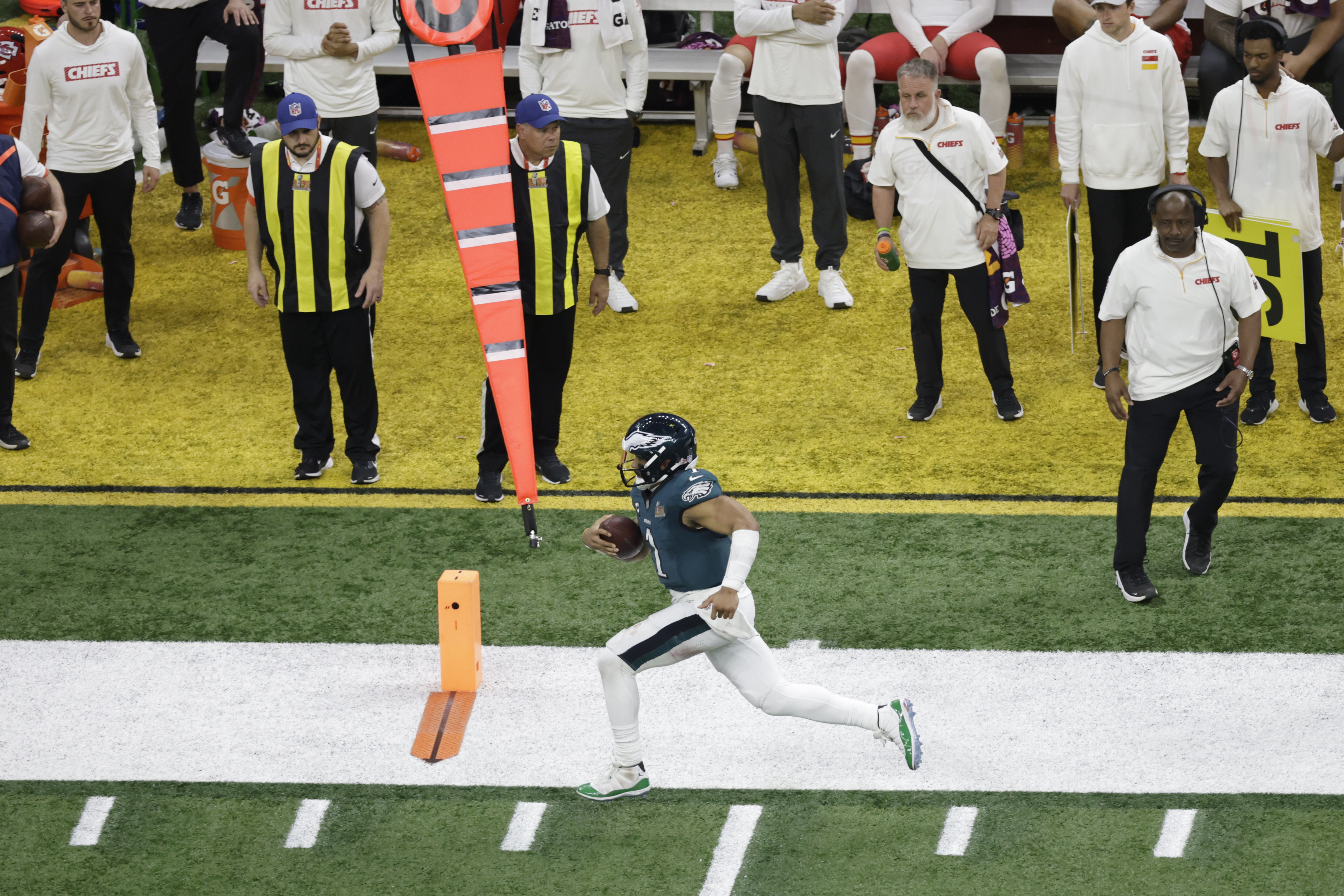 Philadelphia Eagles quarterback Jalen Hurts (1) runs the ball against the Kansas City Chiefs during the NFL Super Bowl 59 football game Sunday, Feb. 9, 2025, in New Orleans. (AP Photo/Adam Hunger)