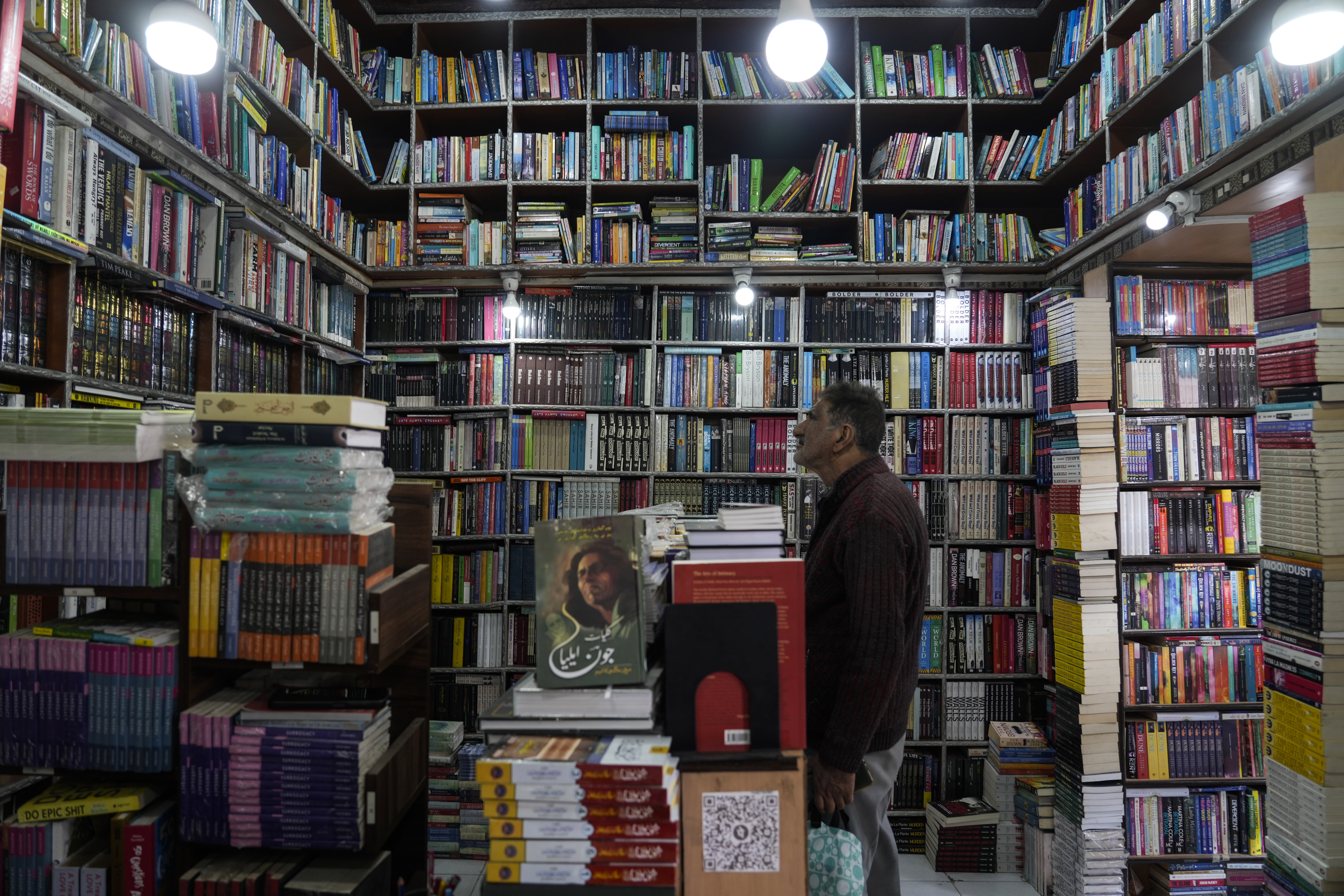 A Kashmiri man looks inside a book shop in Srinagar.